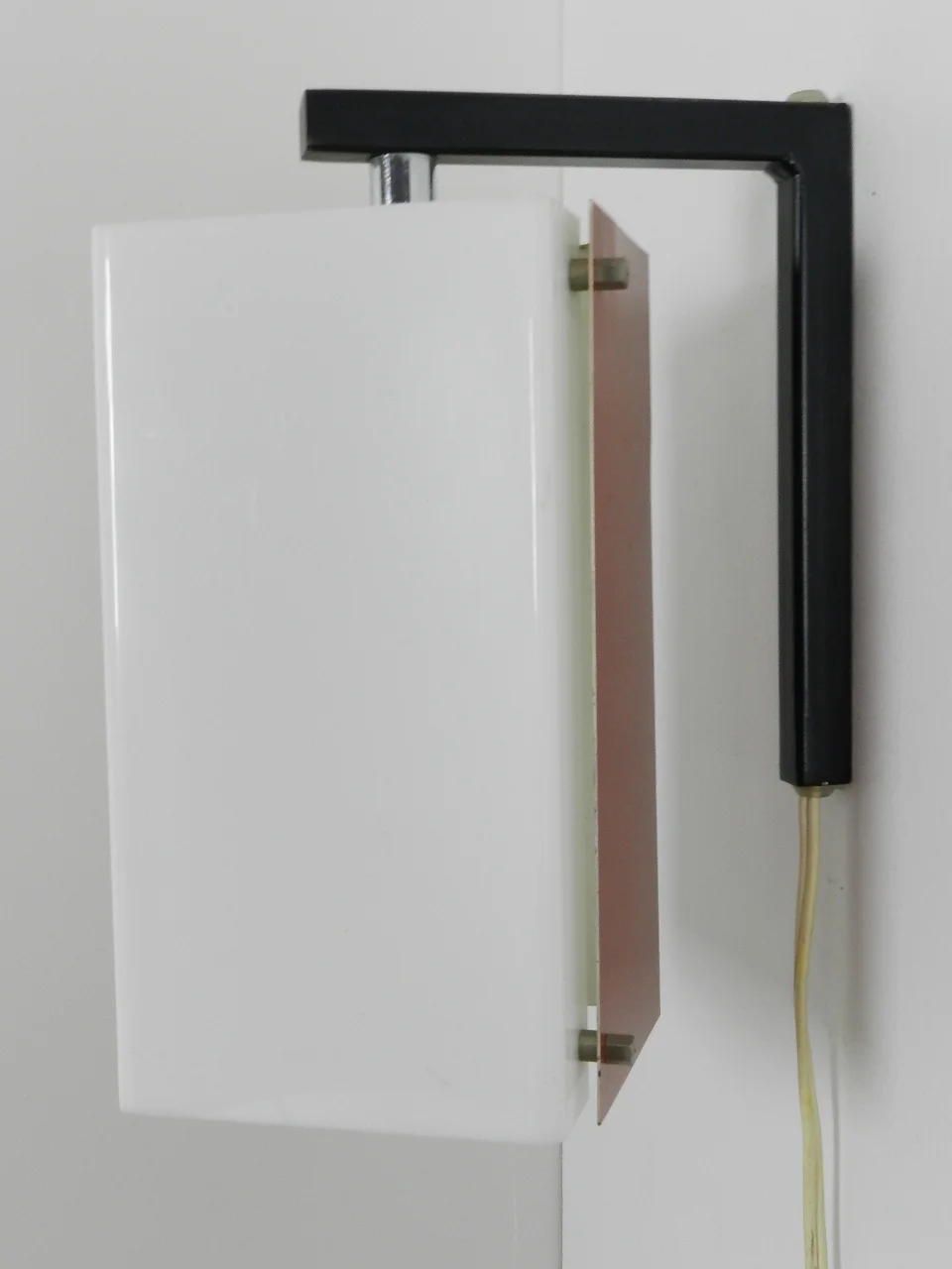 Wall lamp with pivoting shade in enameled metal and acrylic.  Netherlands, 1960s.