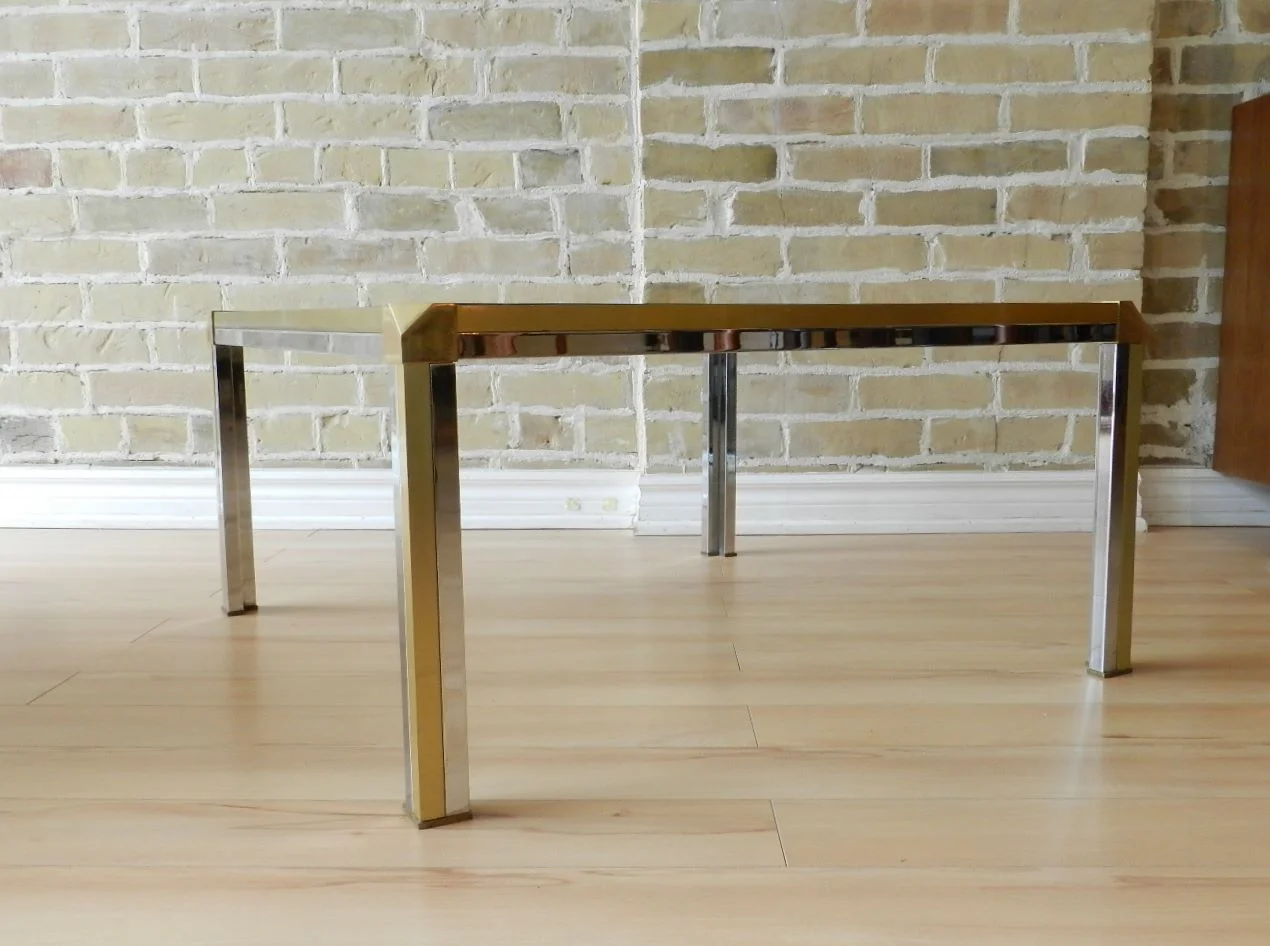 Coffee table in the style of Romeo Rega. Brass, chrome with glass top.  circa 1970s.