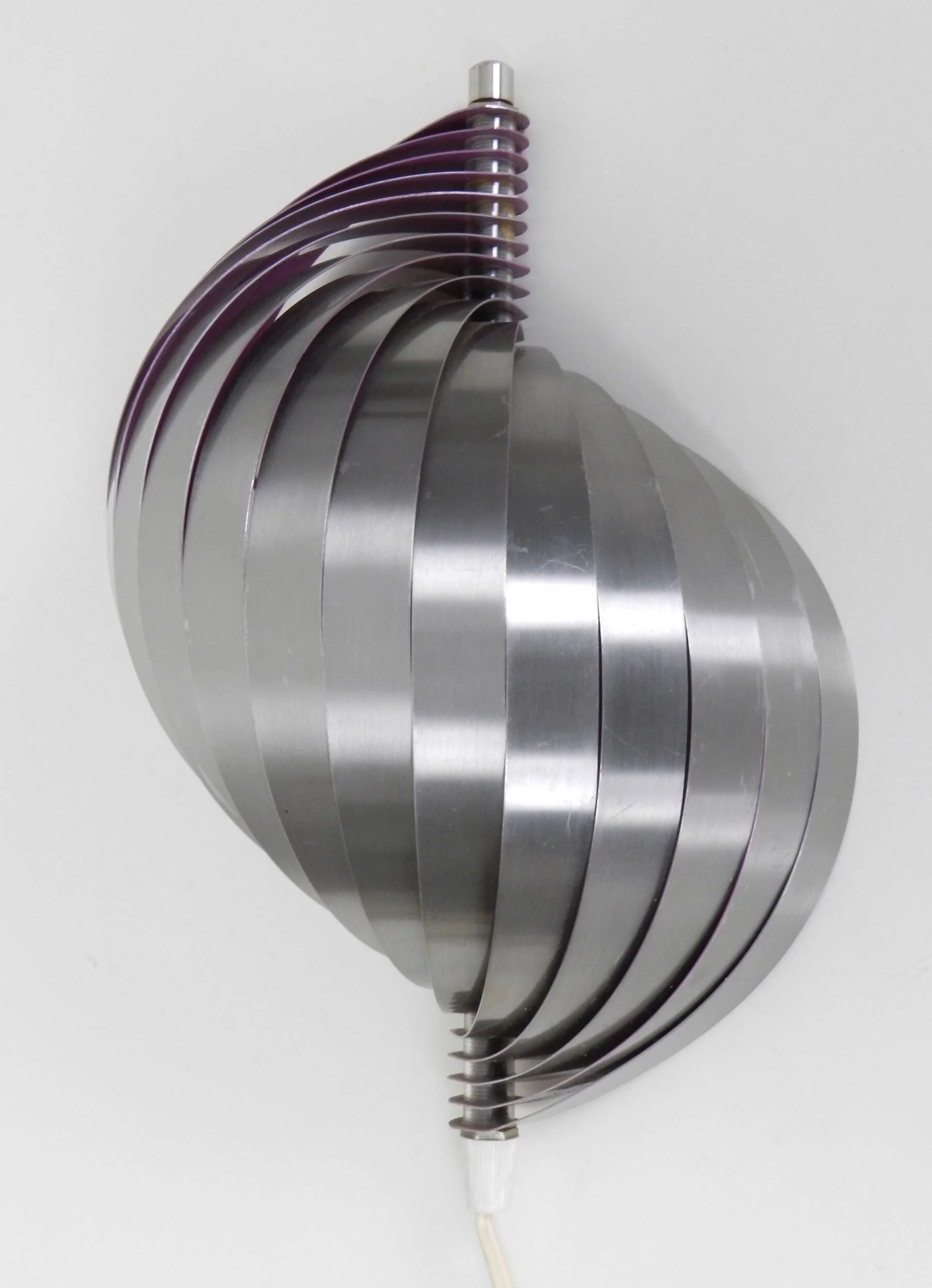 Polished steel wall lamp with purple interior.  Designed by Henri Mathieu.  France, 1970s.