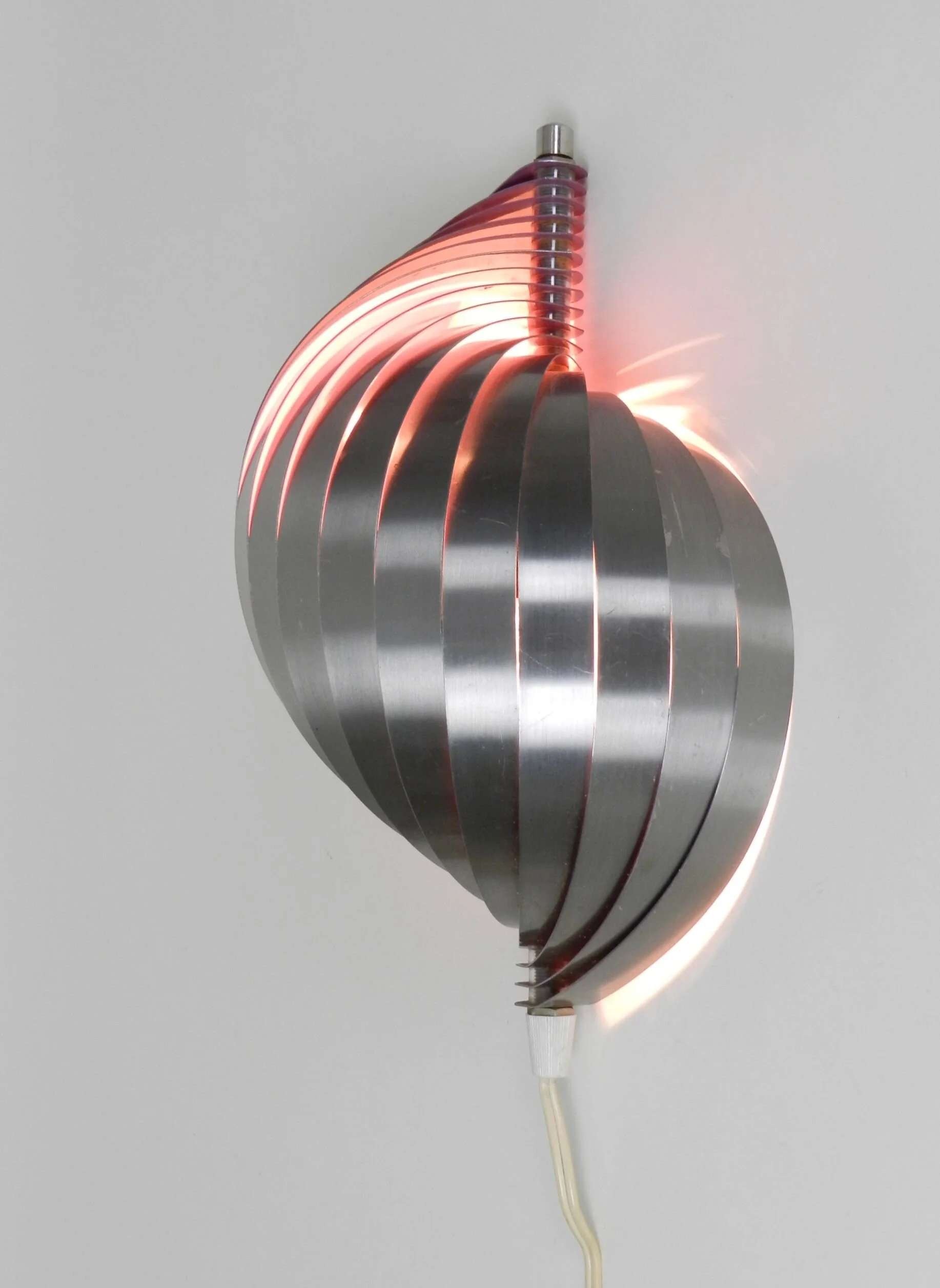 Polished steel wall lamp with purple interior.  Designed by Henri Mathieu.  France, 1970s.