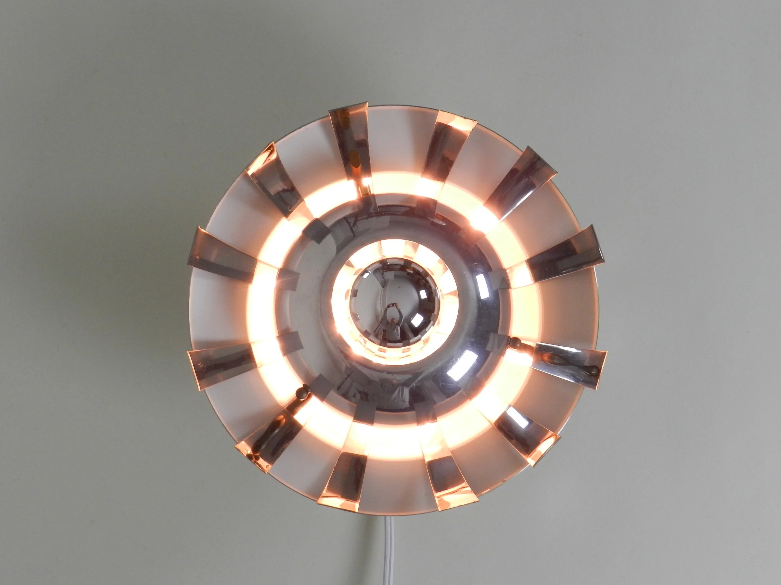 Space age wall lamp in polished aluminum.  France, 1970s.