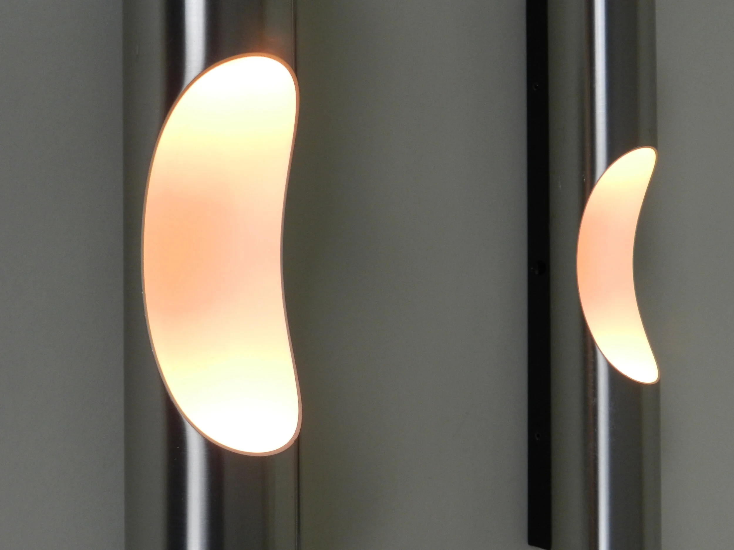 Pair of “Fuga” wall lamps in aluminum, designed by Maija Liisa Komulainen for Raak.  The Netherlands, 1960s.