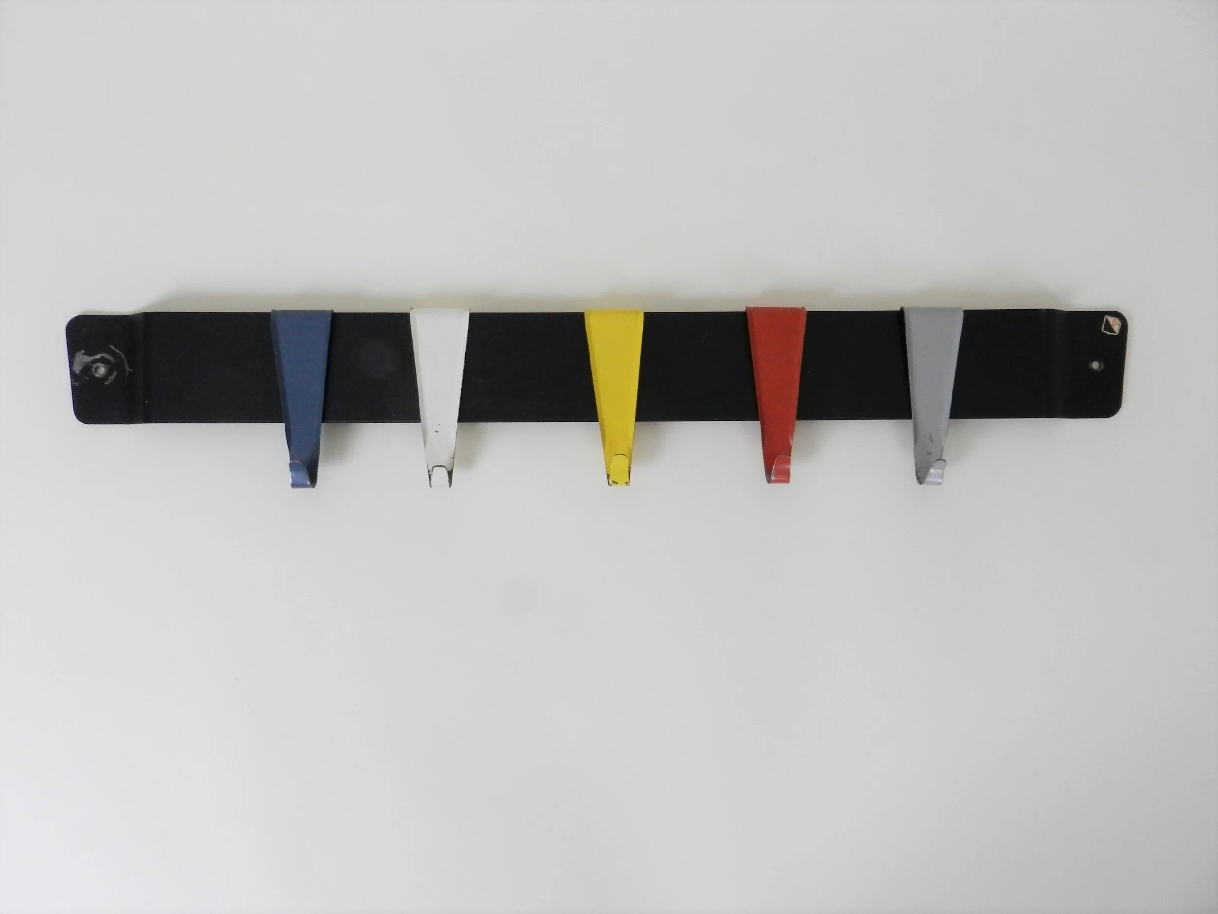 Enameled metal coat rack designed by Coen de Vries for Pilastro.  Netherlands, 1950s.
