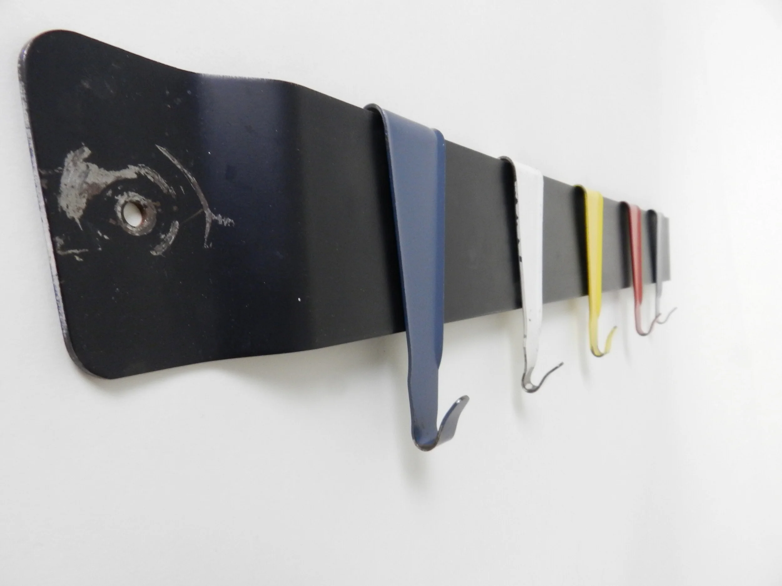 Enameled metal coat rack designed by Coen de Vries for Pilastro.  Netherlands, 1950s.