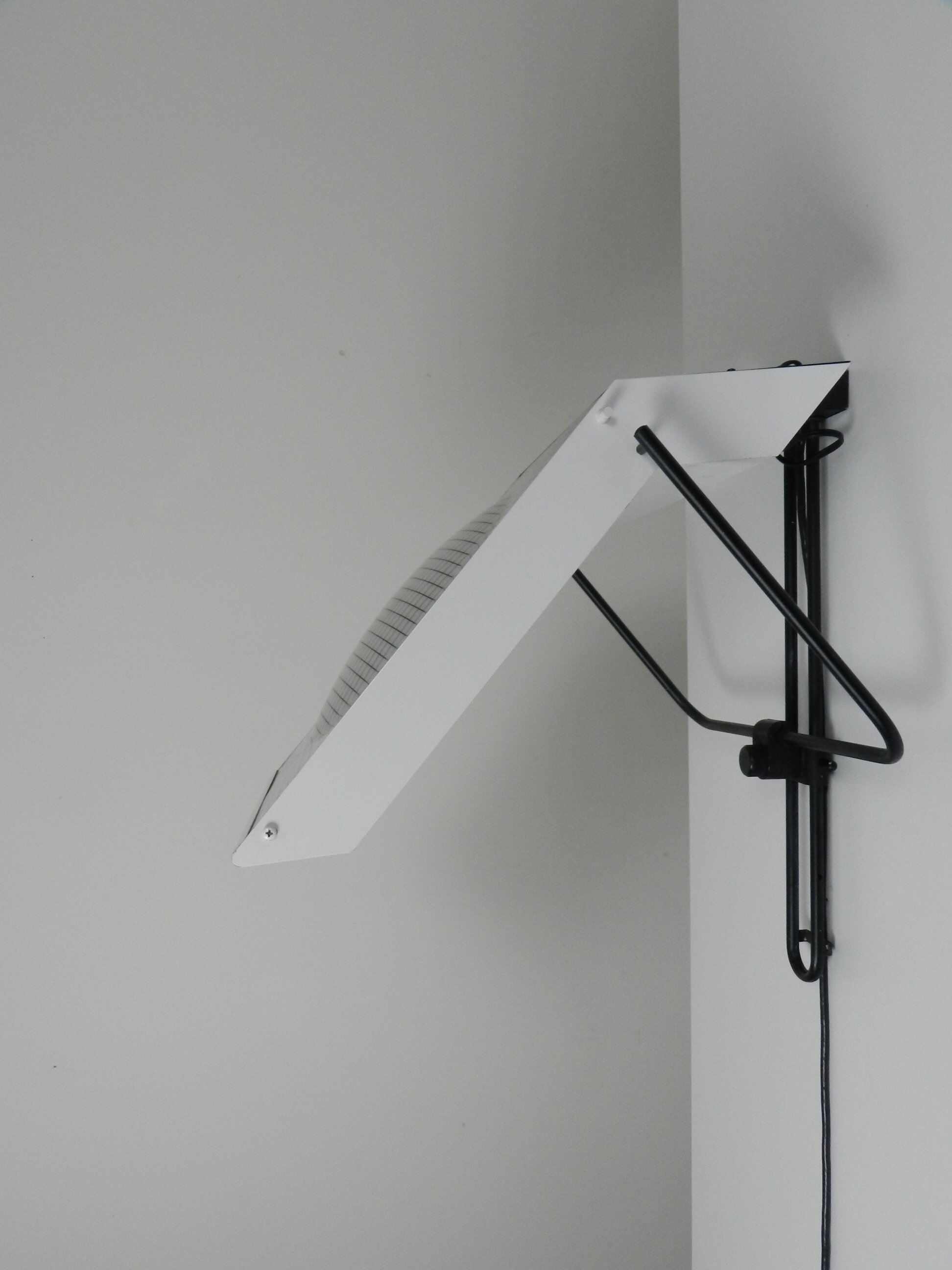 Post modern wall lamp in enameled metal with acrylic diffuser.  Created by Stilnovo.  Italy, 1980s.
