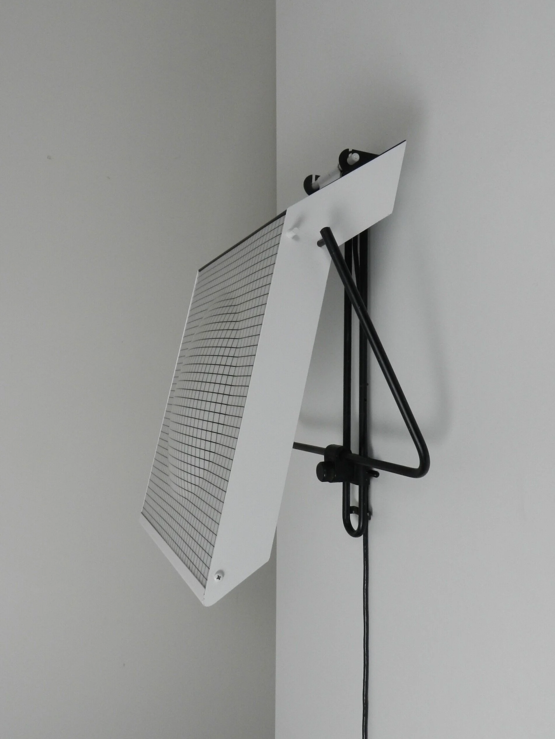 Post modern wall lamp in enameled metal with acrylic diffuser.  Created by Stilnovo.  Italy, 1980s.