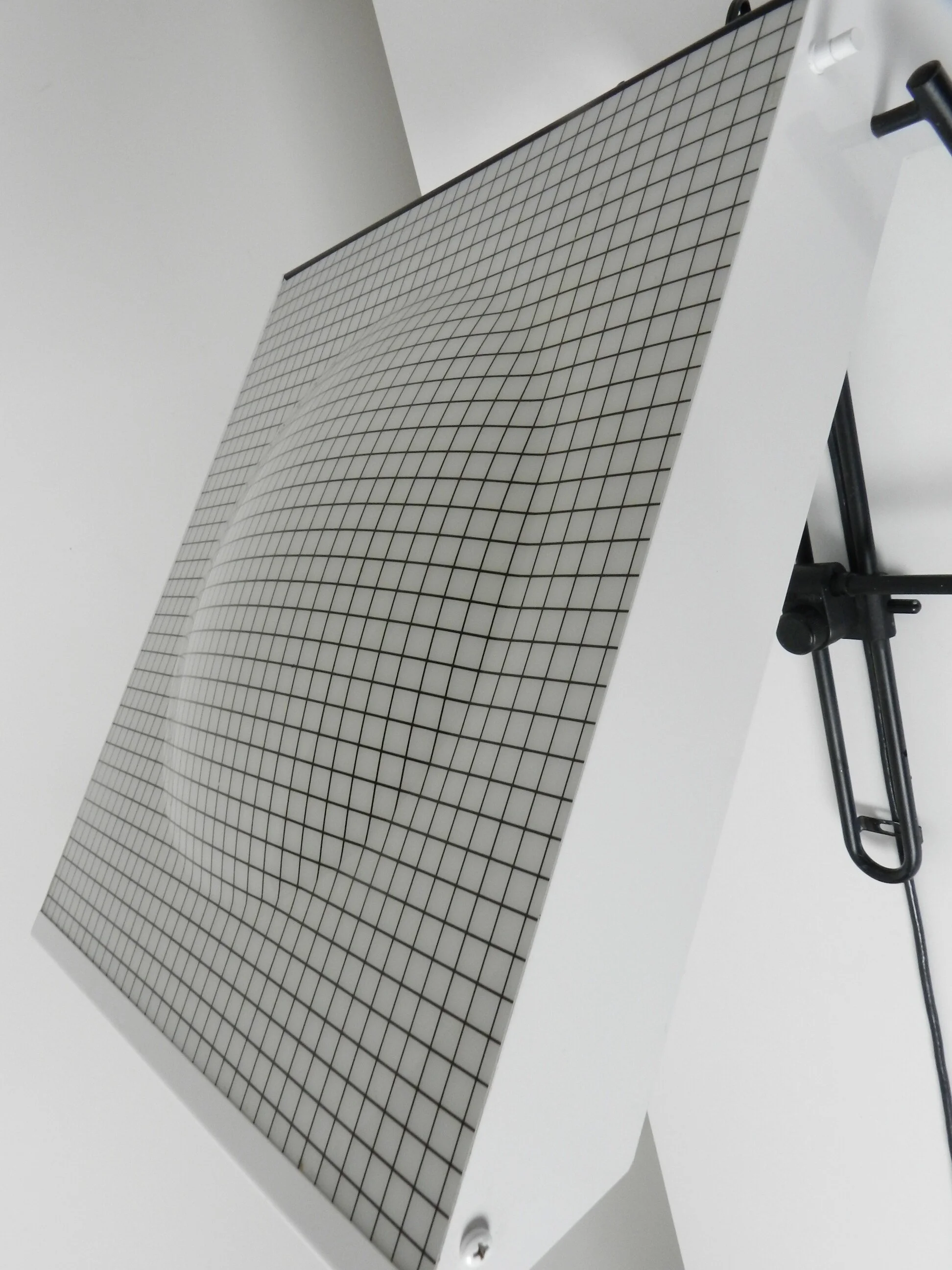 Post modern wall lamp in enameled metal with acrylic diffuser.  Created by Stilnovo.  Italy, 1980s.