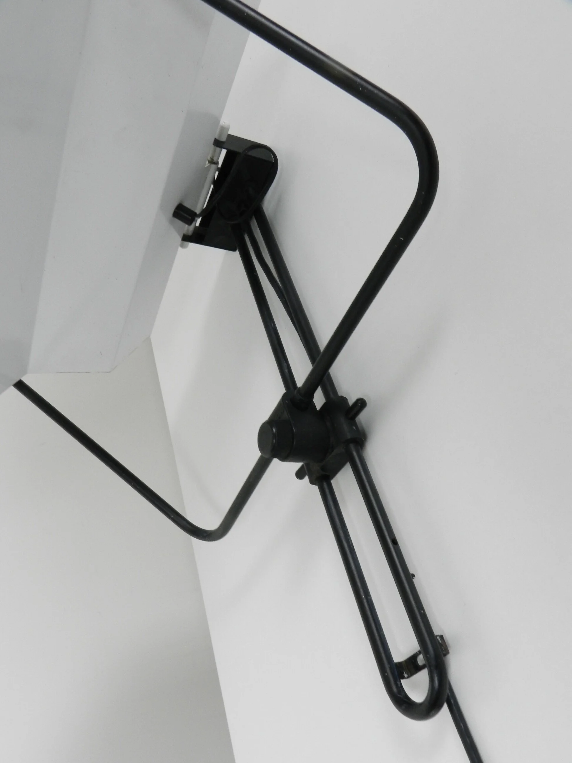 Post modern wall lamp in enameled metal with acrylic diffuser.  Created by Stilnovo.  Italy, 1980s.