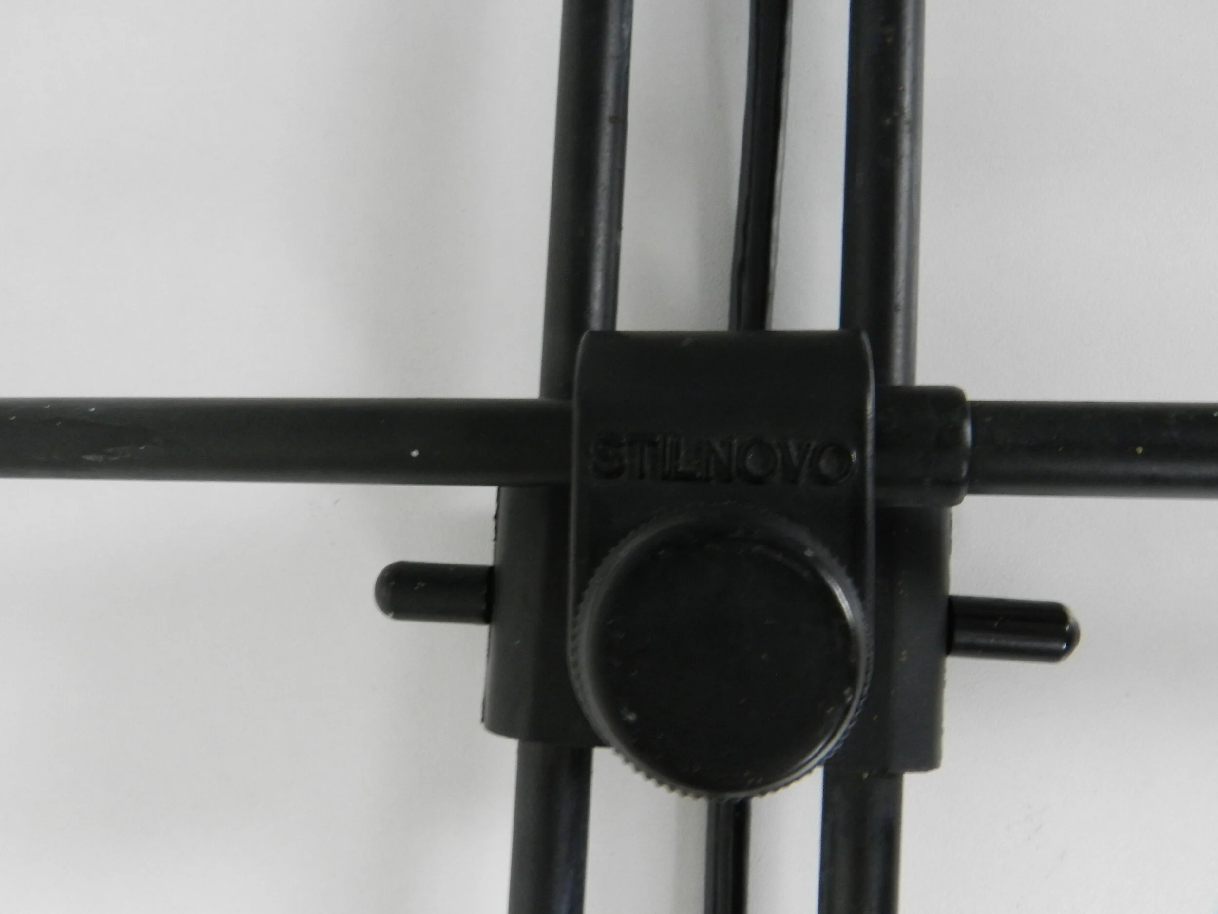 Post modern wall lamp in enameled metal with acrylic diffuser.  Created by Stilnovo.  Italy, 1980s.