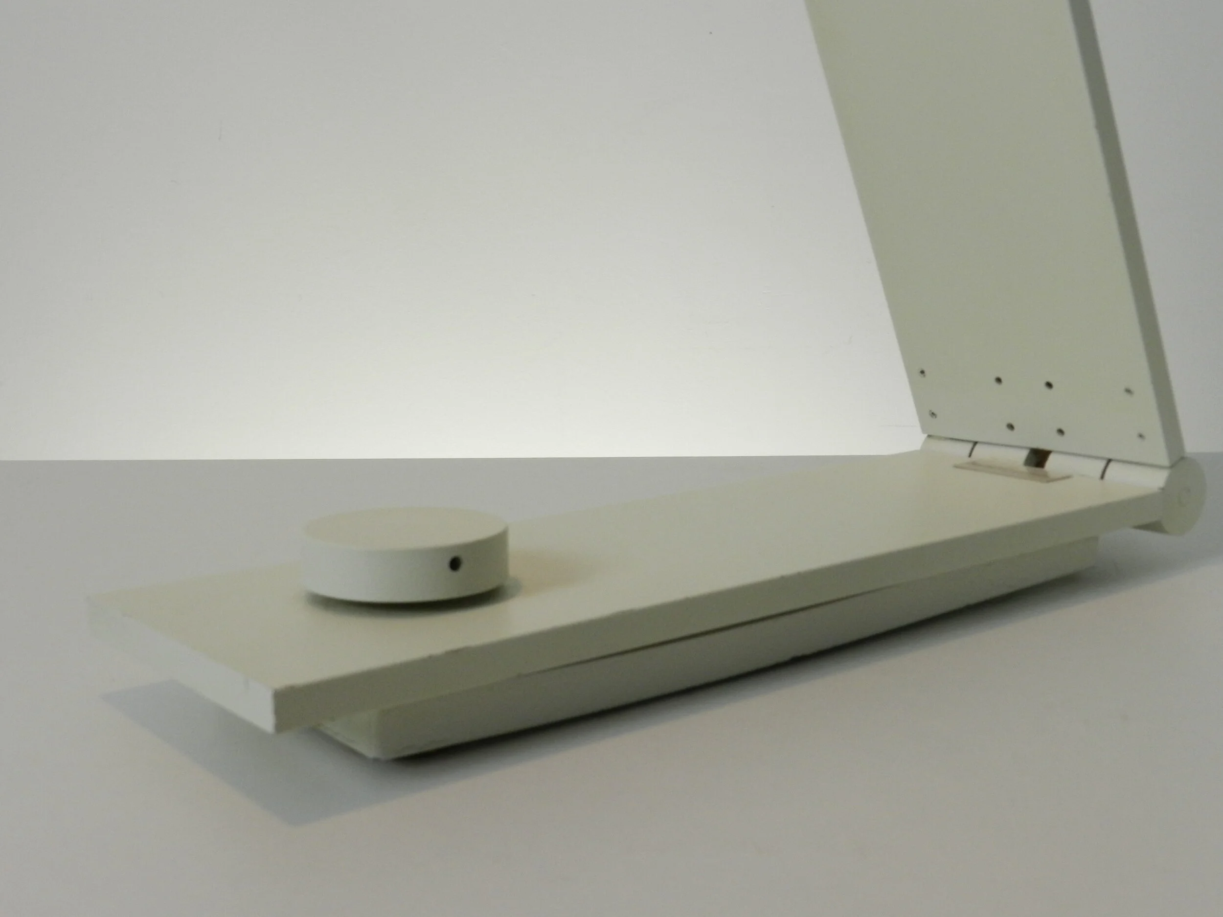 Modernist desk lamp in enameled metal designed by Alessandro Traversi.  Italy, 1980s.