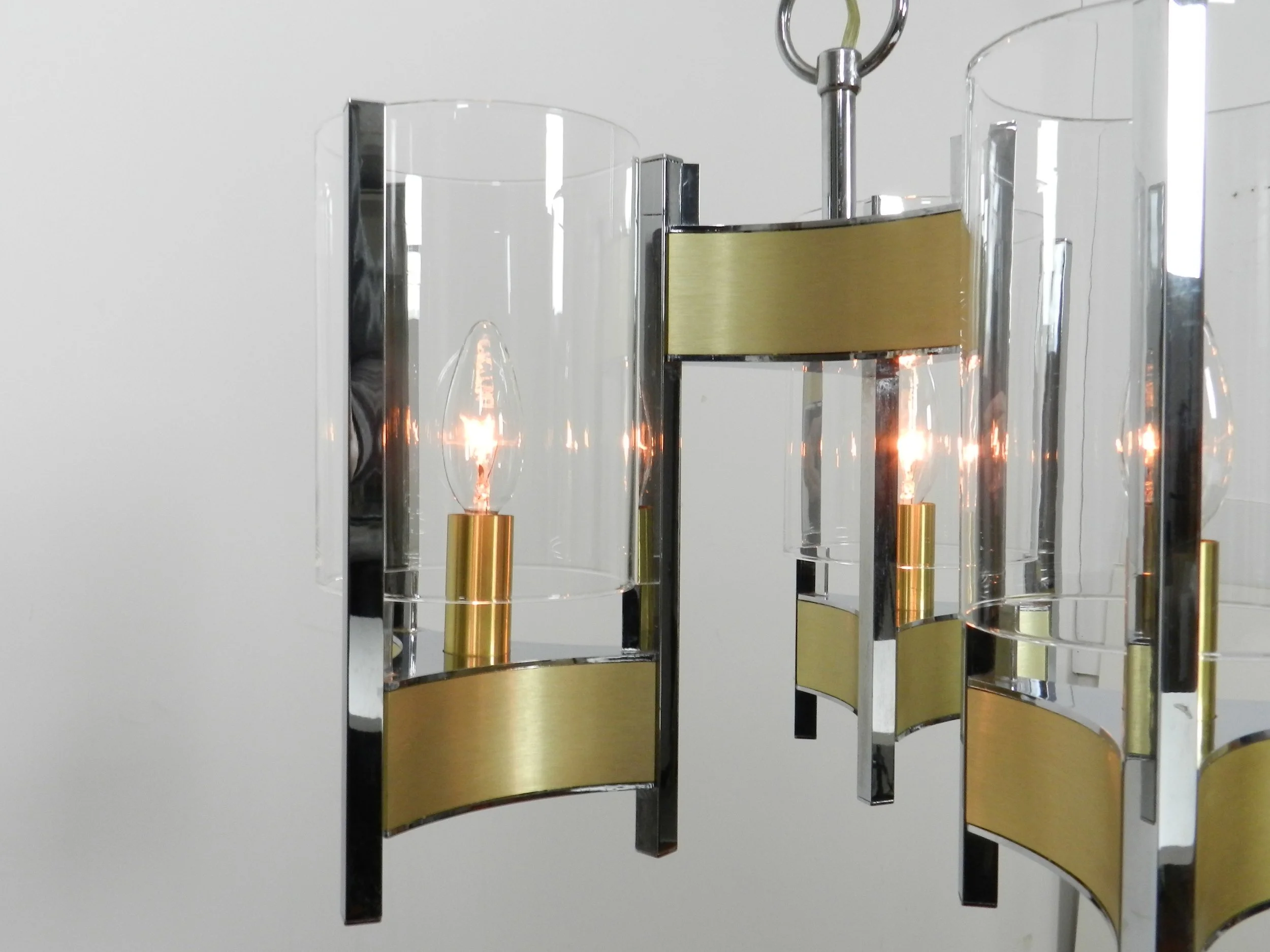 Chrome and brass chandelier with glass shades designed by Gaetano Sciolari.  Italy, 1970s.