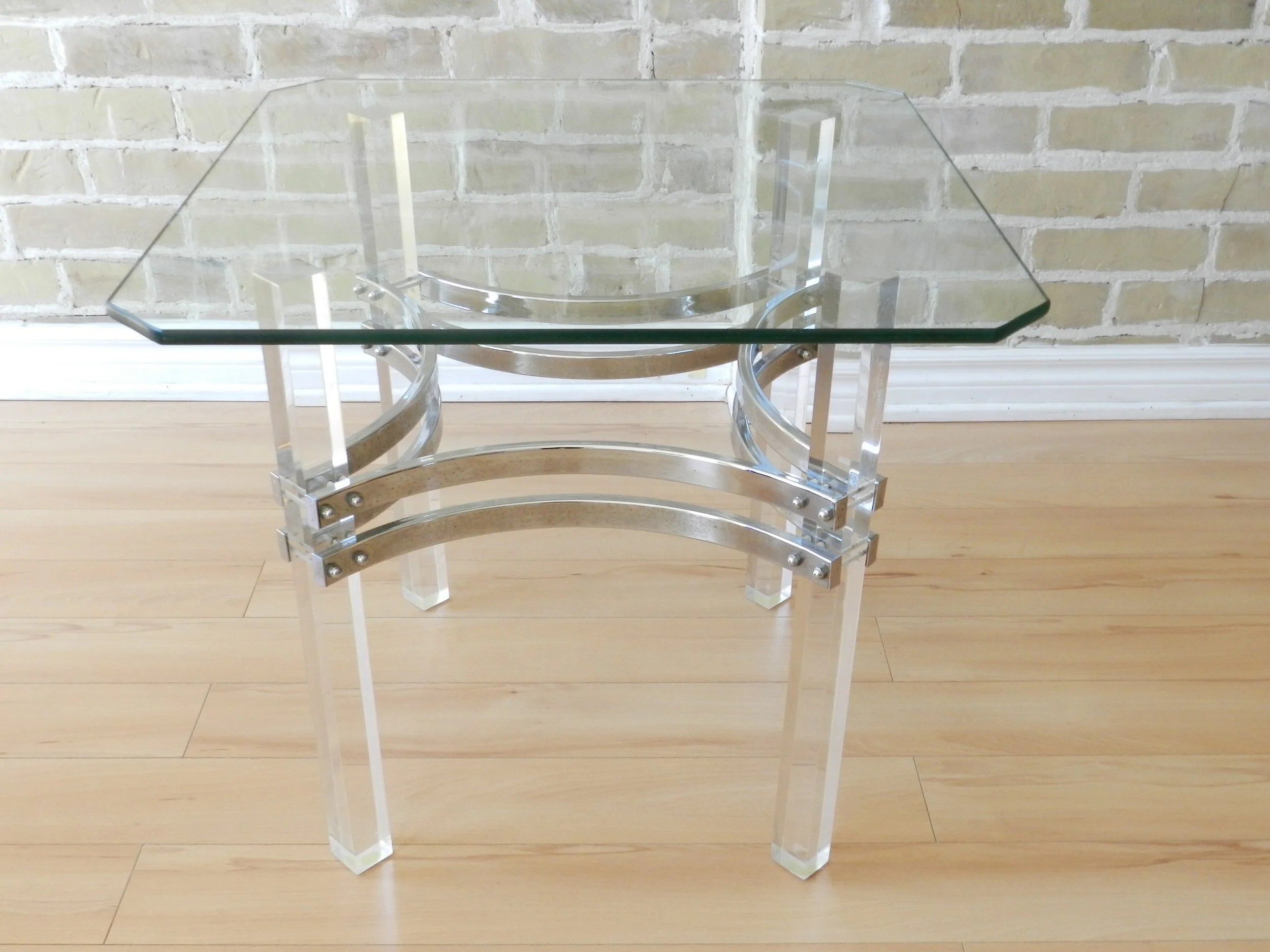Modernist side table in lucite and chrome with glass top.  circa 1980s.