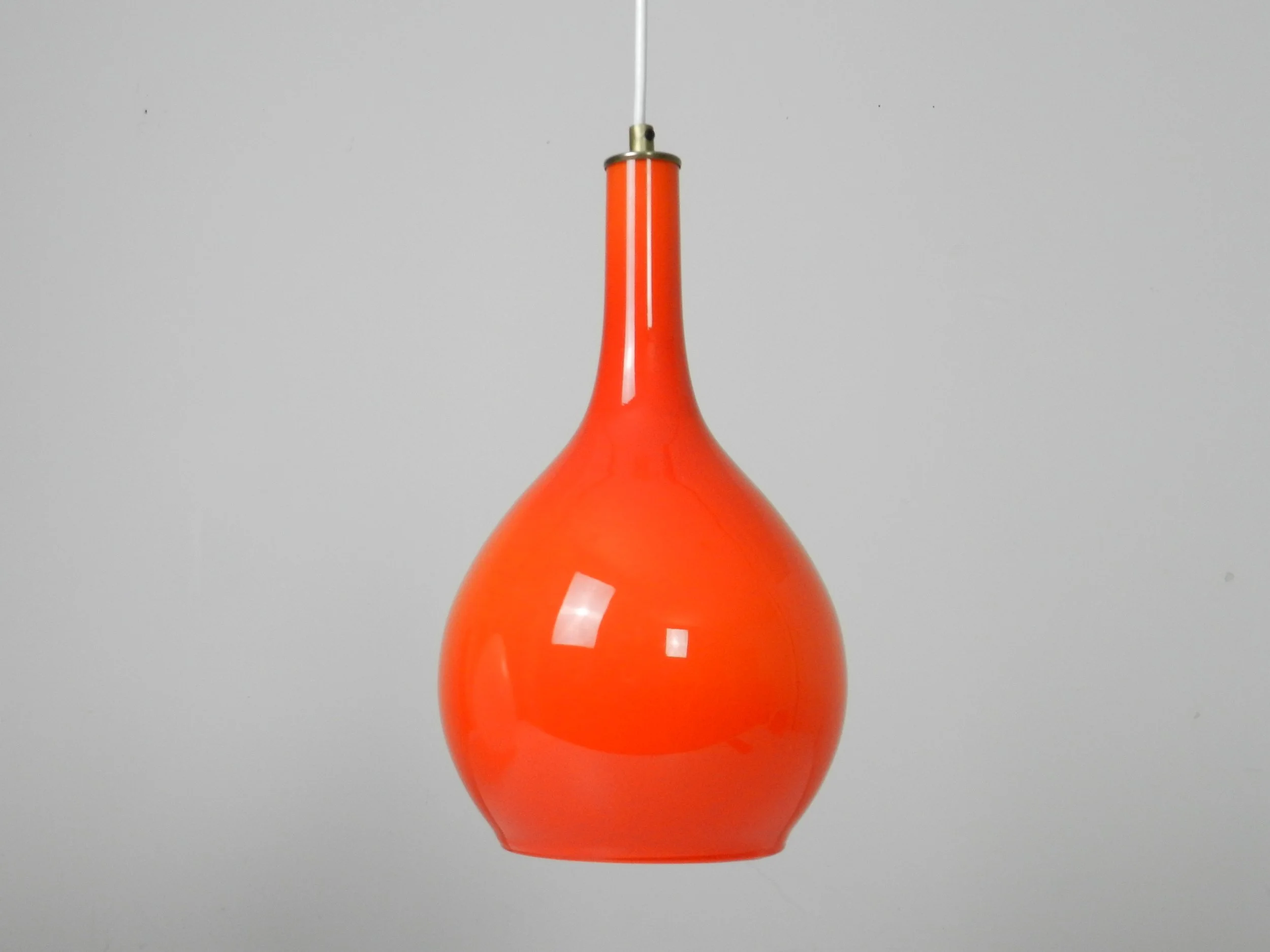 Orange and white cased glass pendant lamp.  Scandinavia, 1960s.