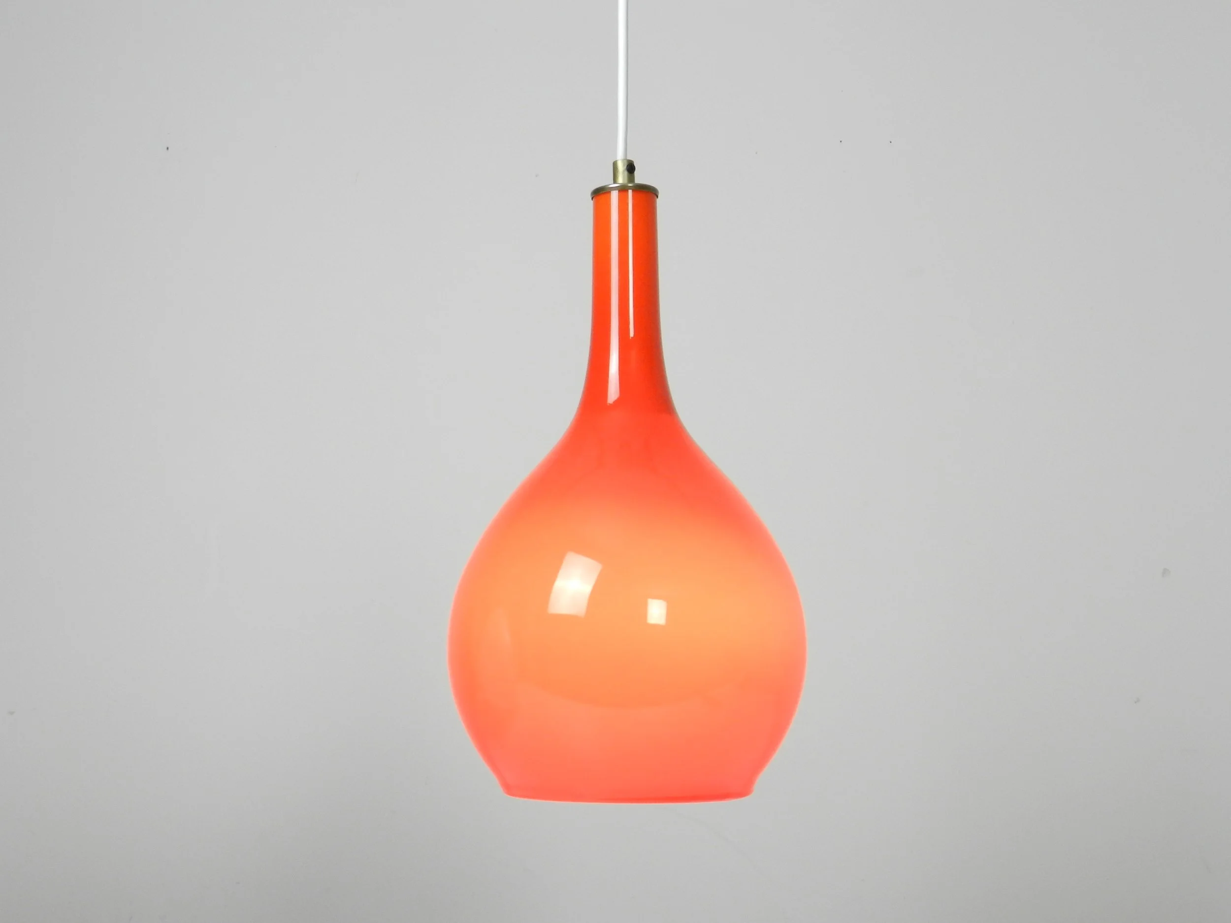 Orange and white cased glass pendant lamp.  Scandinavia, 1960s.