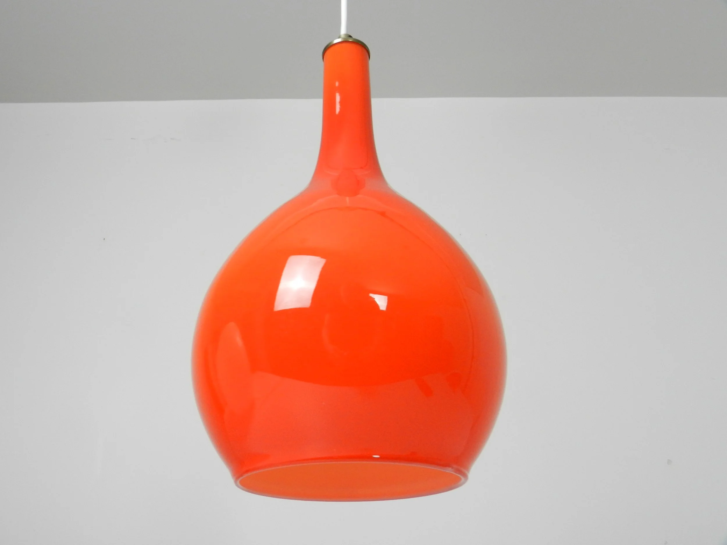 Orange and white cased glass pendant lamp.  Scandinavia, 1960s.