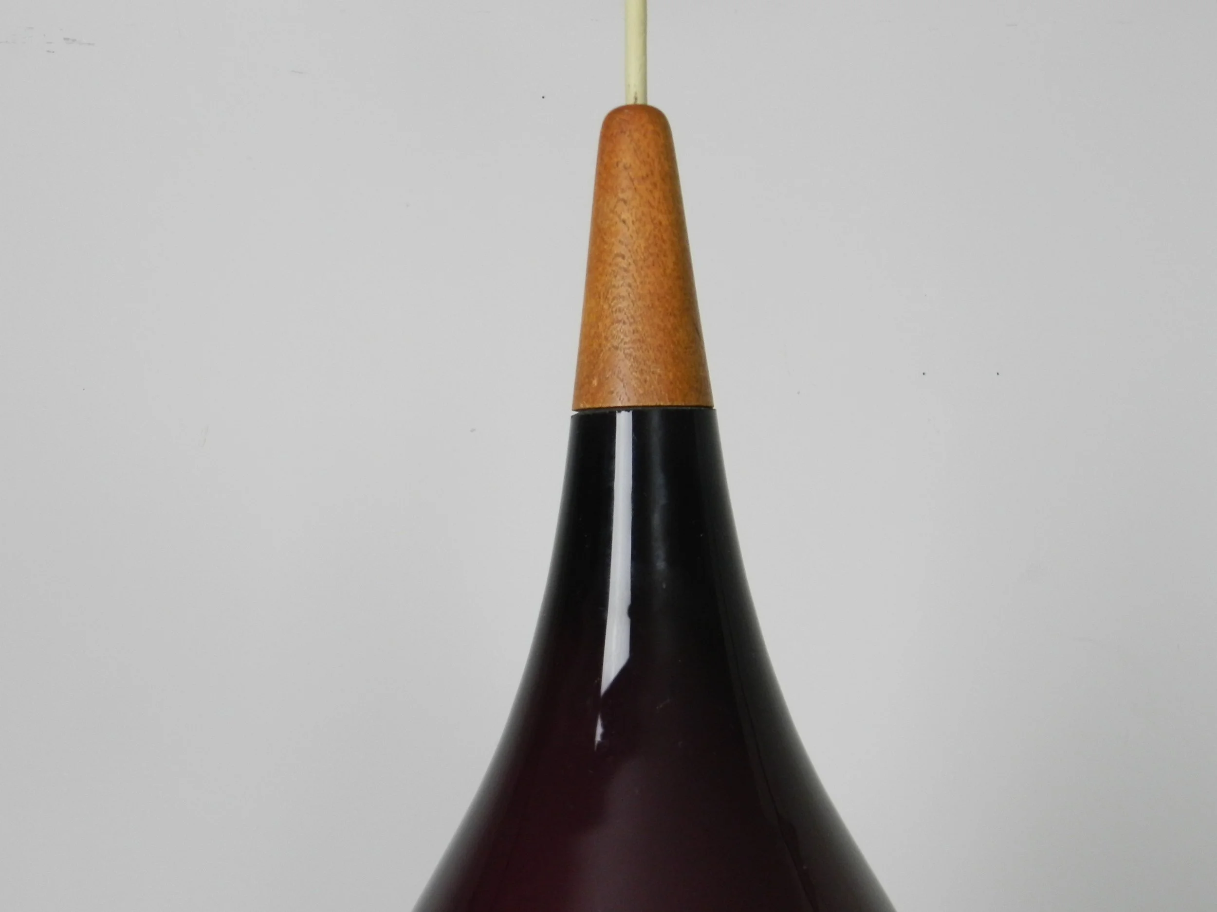 Cased glass pendant lamp with teak finial by Holmegaard.  Denmark, 1960s.