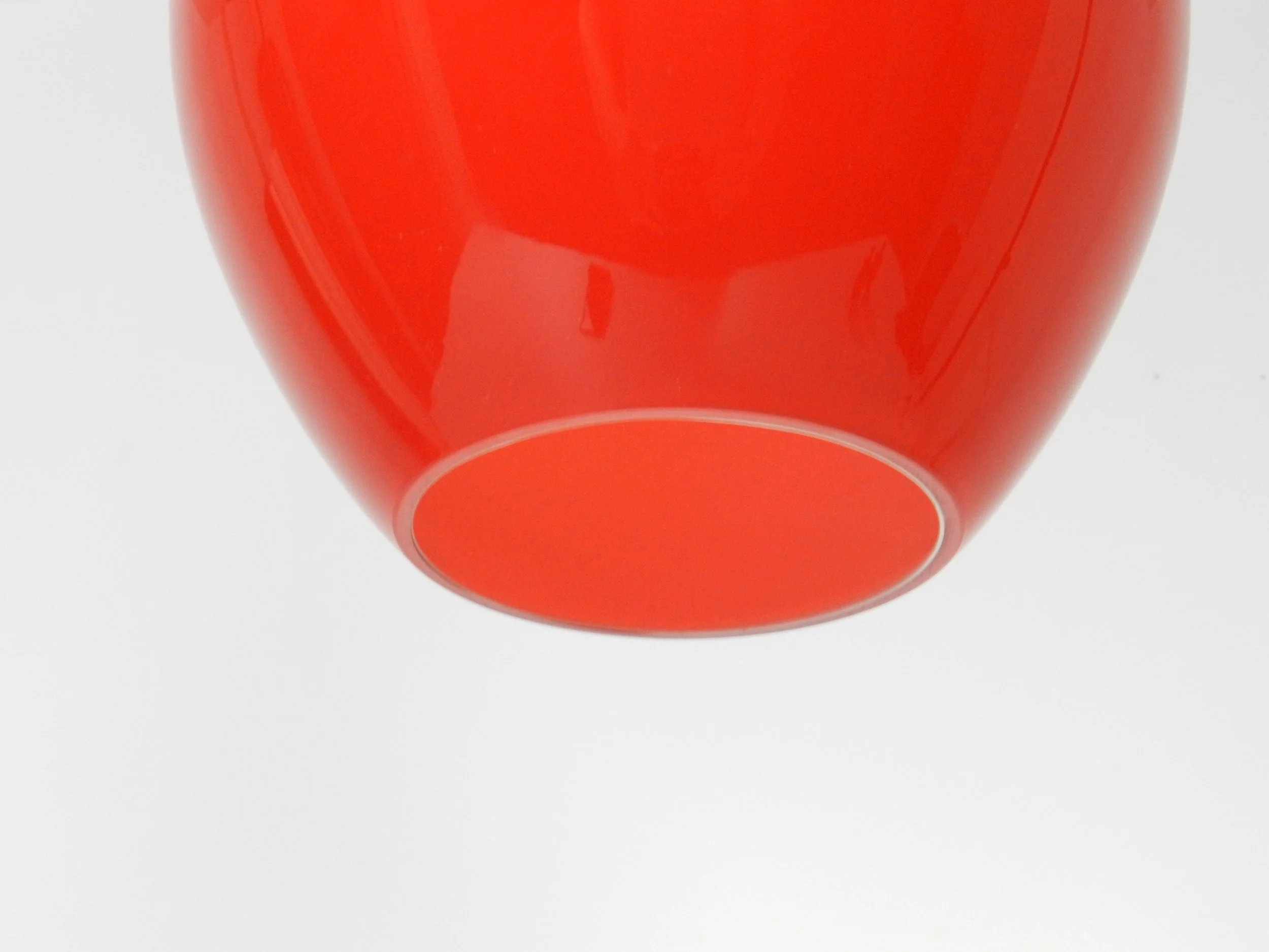 Red cased glass pendant lamp with teak finial by Holmegaard.  Denmark, 1960s.