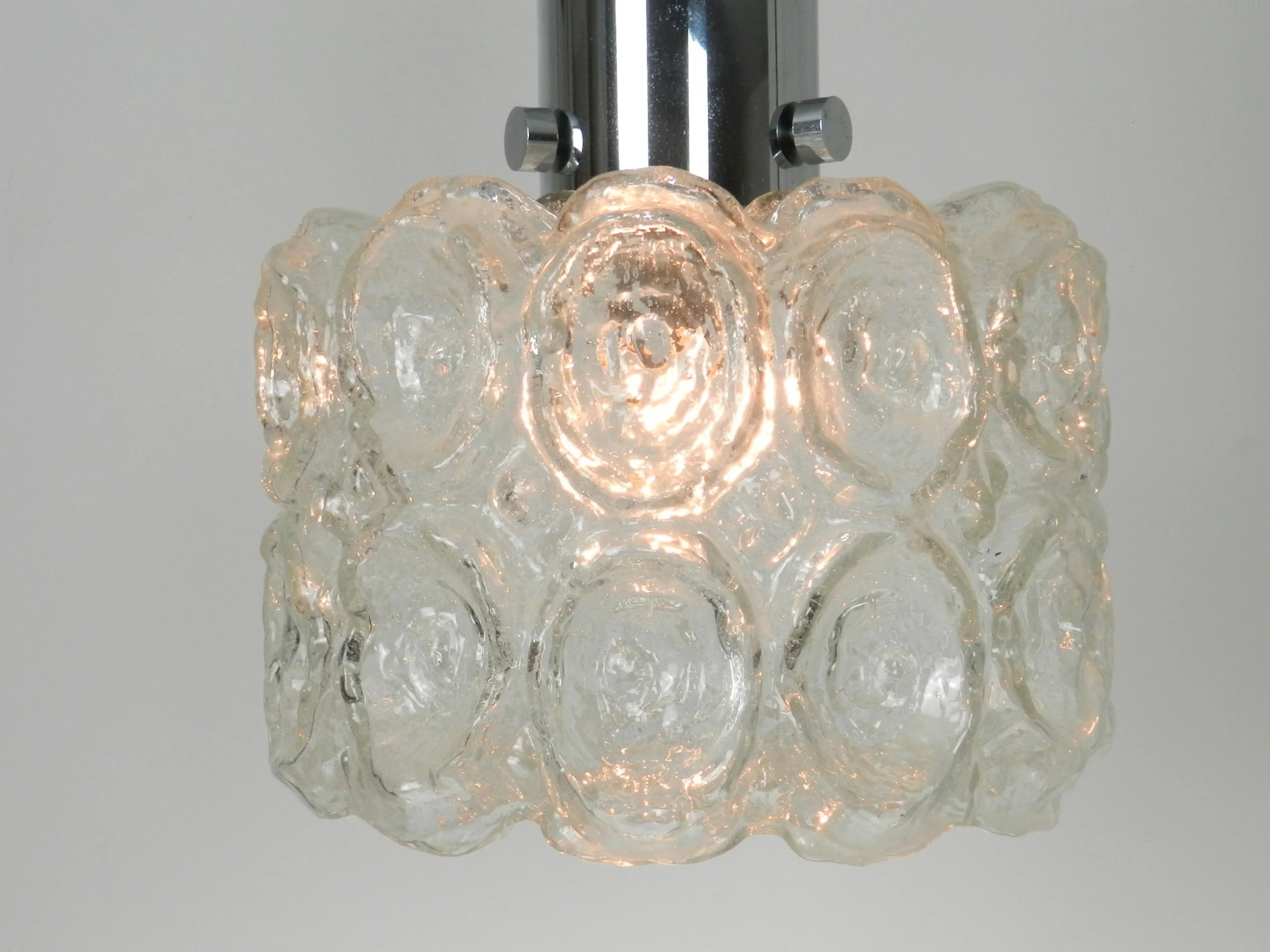 Pendant  lamp in clear textured glass and chrome by Limburg.  Germany, 1970s.