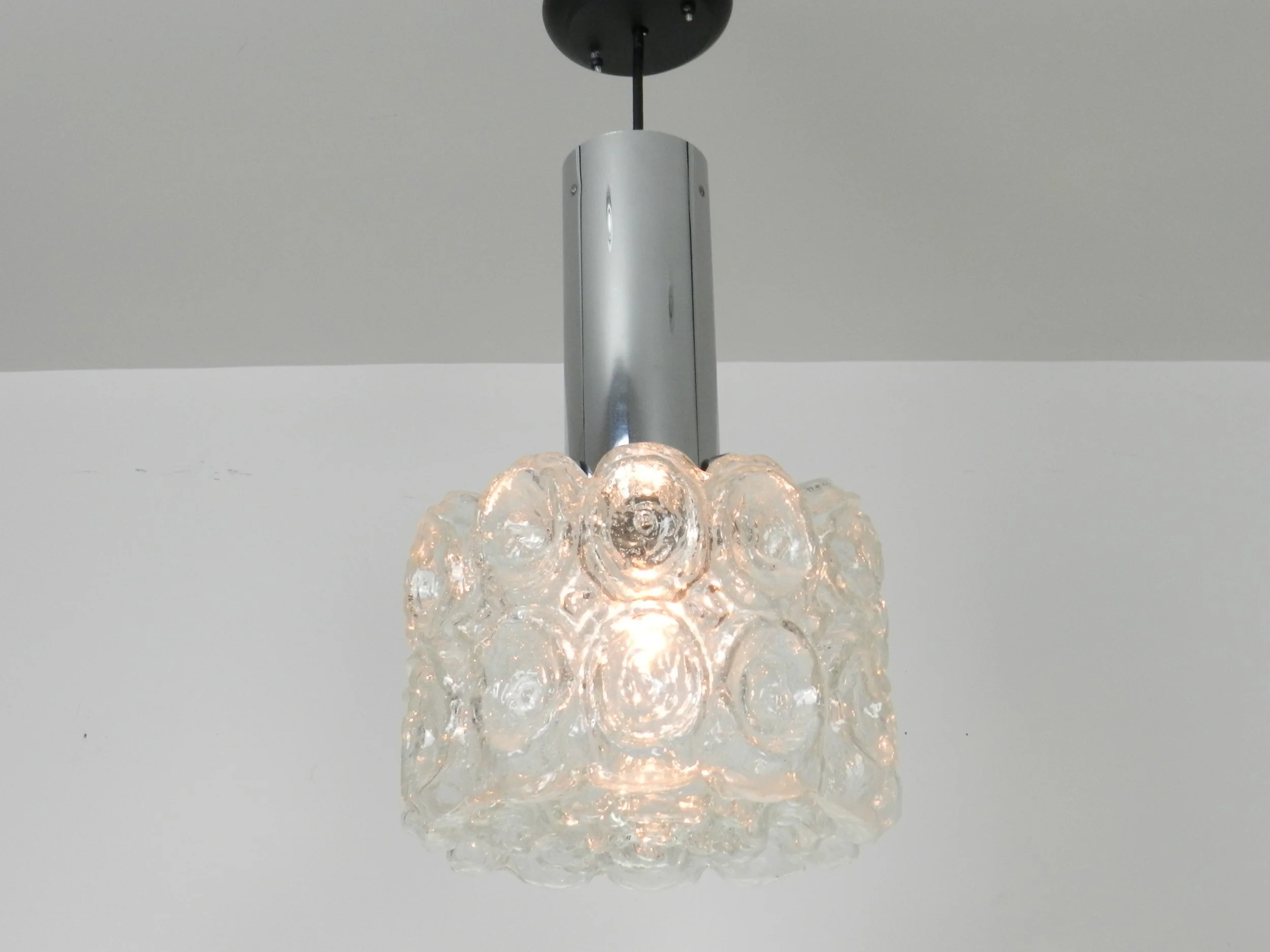 Pendant  lamp in clear textured glass and chrome by Limburg.  Germany, 1970s.
