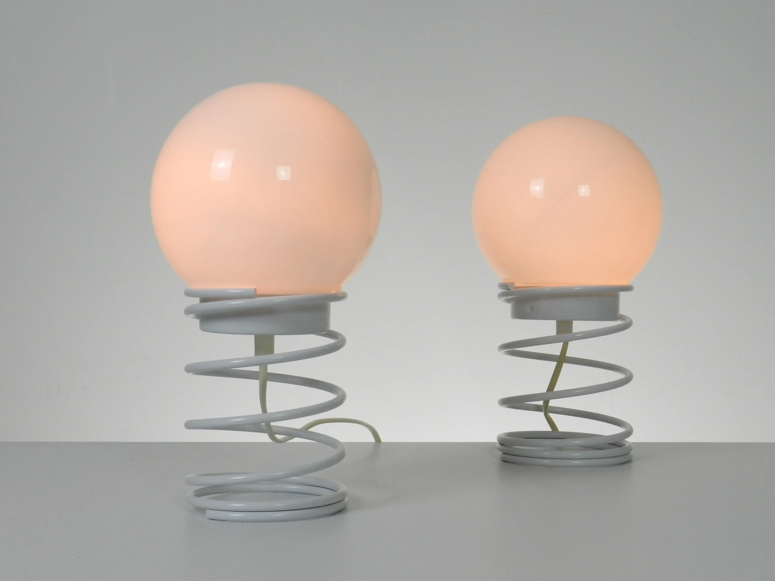 Pair of space age spiral lamp by Woja in painted metal with glass shades.  Netherlands, 1970s.