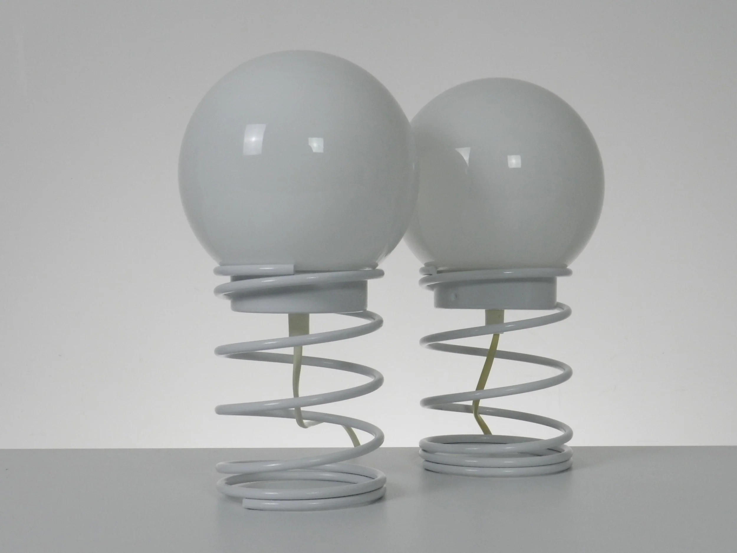 Pair of space age spiral lamp by Woja in painted metal with glass shades.  Netherlands, 1970s.
