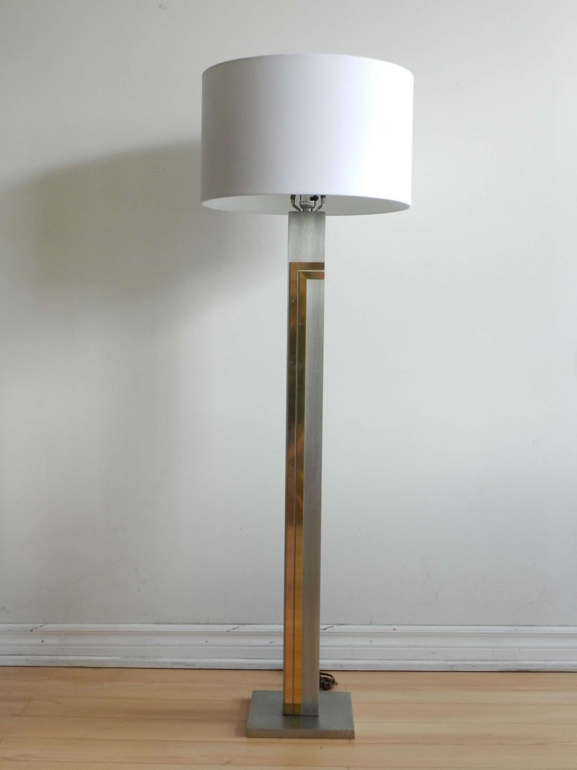 Floor lamp in brushed metal with brass and copper accents designed by Pierre Cardin for Laurel Lamp Company.  USA, 1970s.