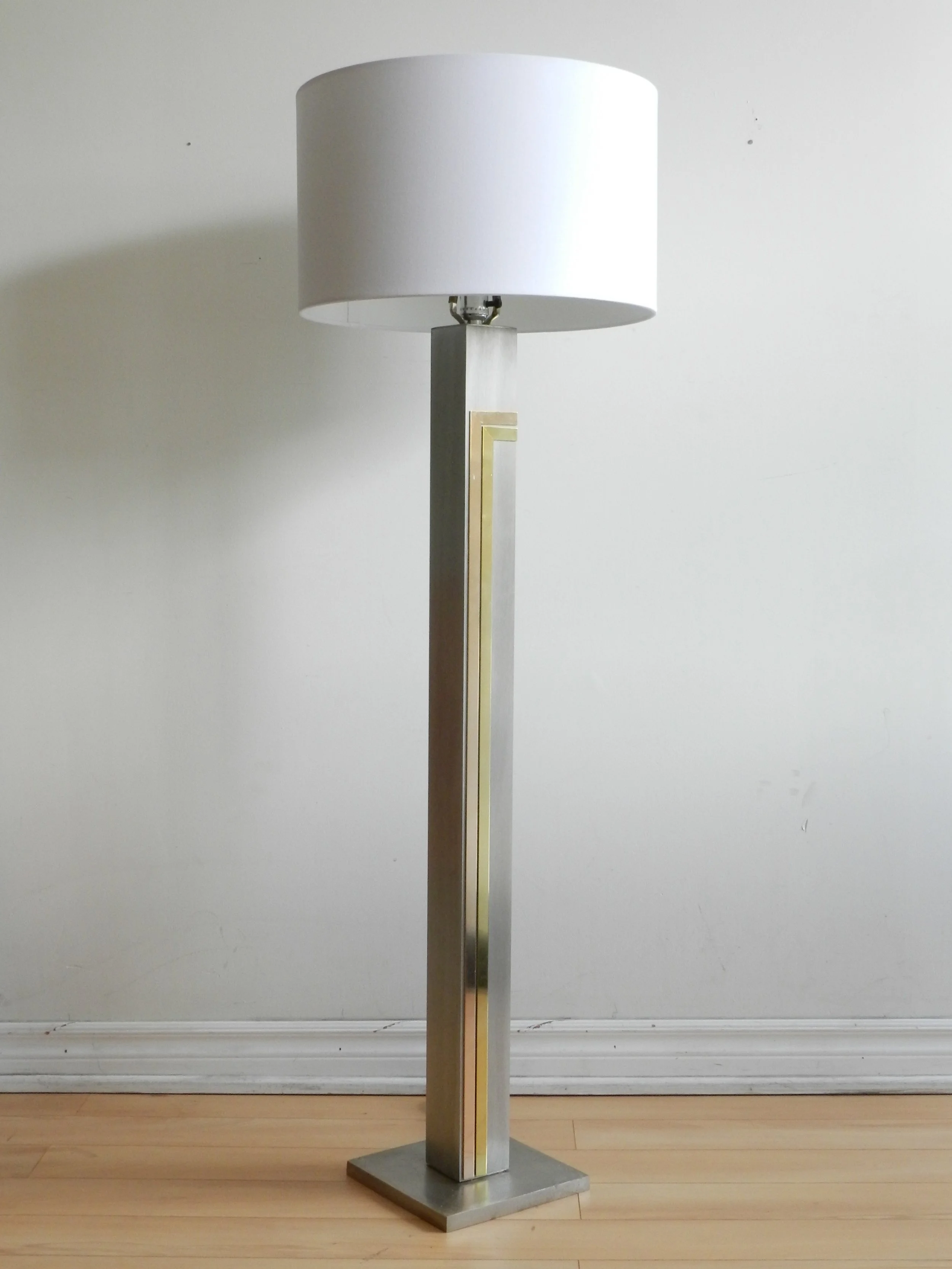 Floor lamp in brushed metal with brass and copper accents designed by Pierre Cardin for Laurel Lamp Company.  USA, 1970s.