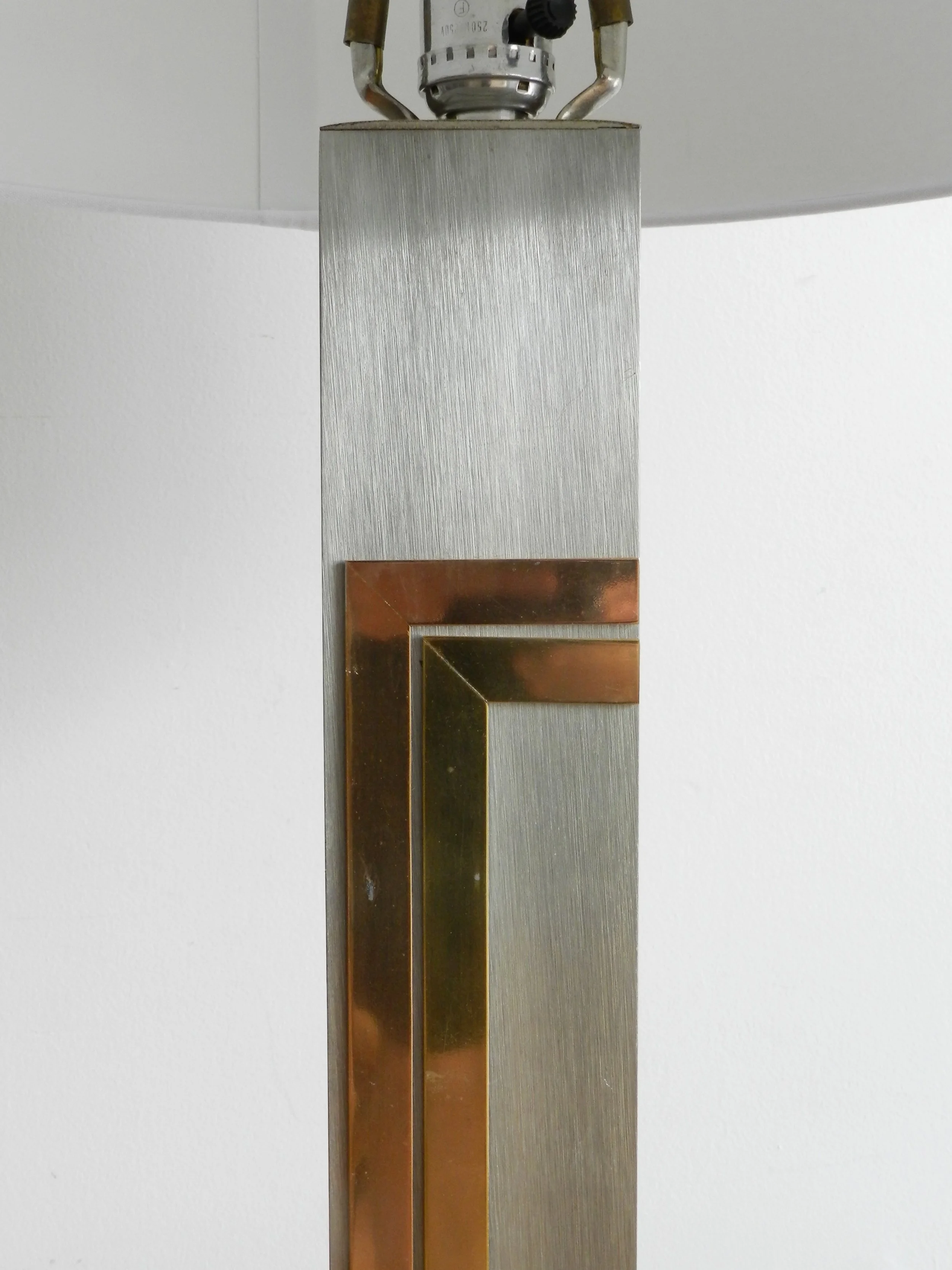 Floor lamp in brushed metal with brass and copper accents designed by Pierre Cardin for Laurel Lamp Company.  USA, 1970s.
