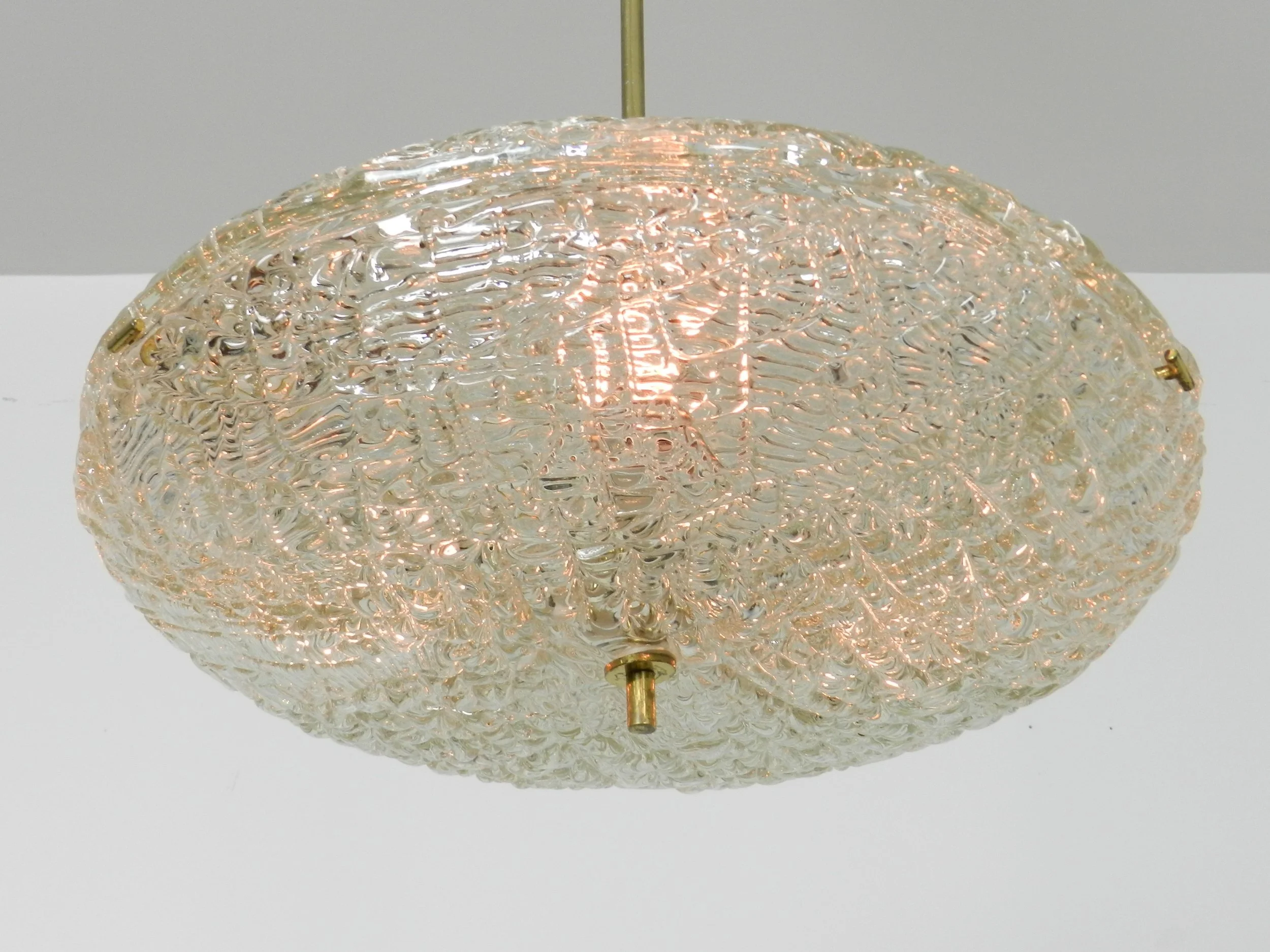 Crystal chandelier with brass hardware designed by Carl Fagerlund for Orrefors.  Sweden, 1950s.