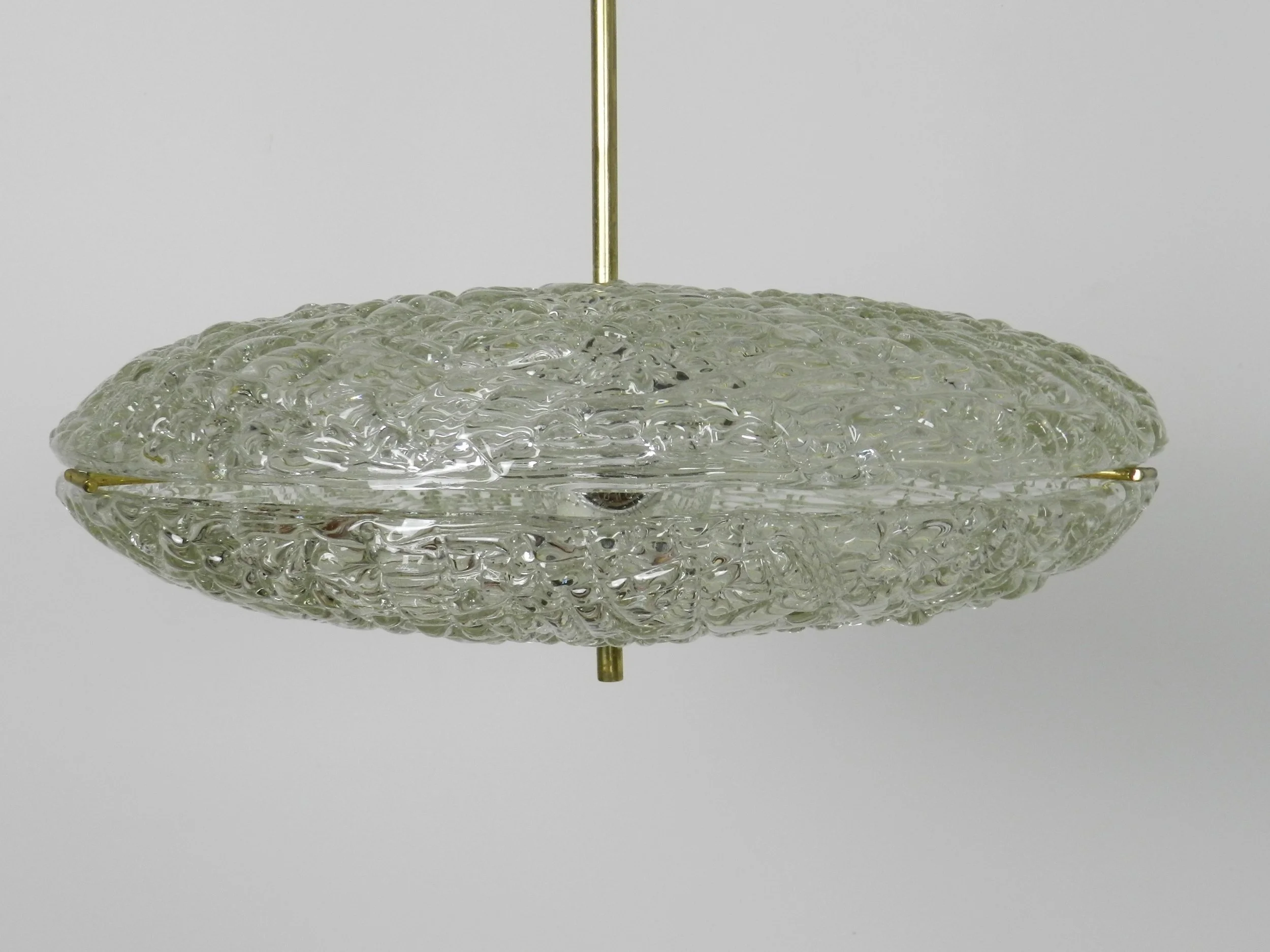 Crystal chandelier with brass hardware designed by Carl Fagerlund for Orrefors.  Sweden, 1950s.