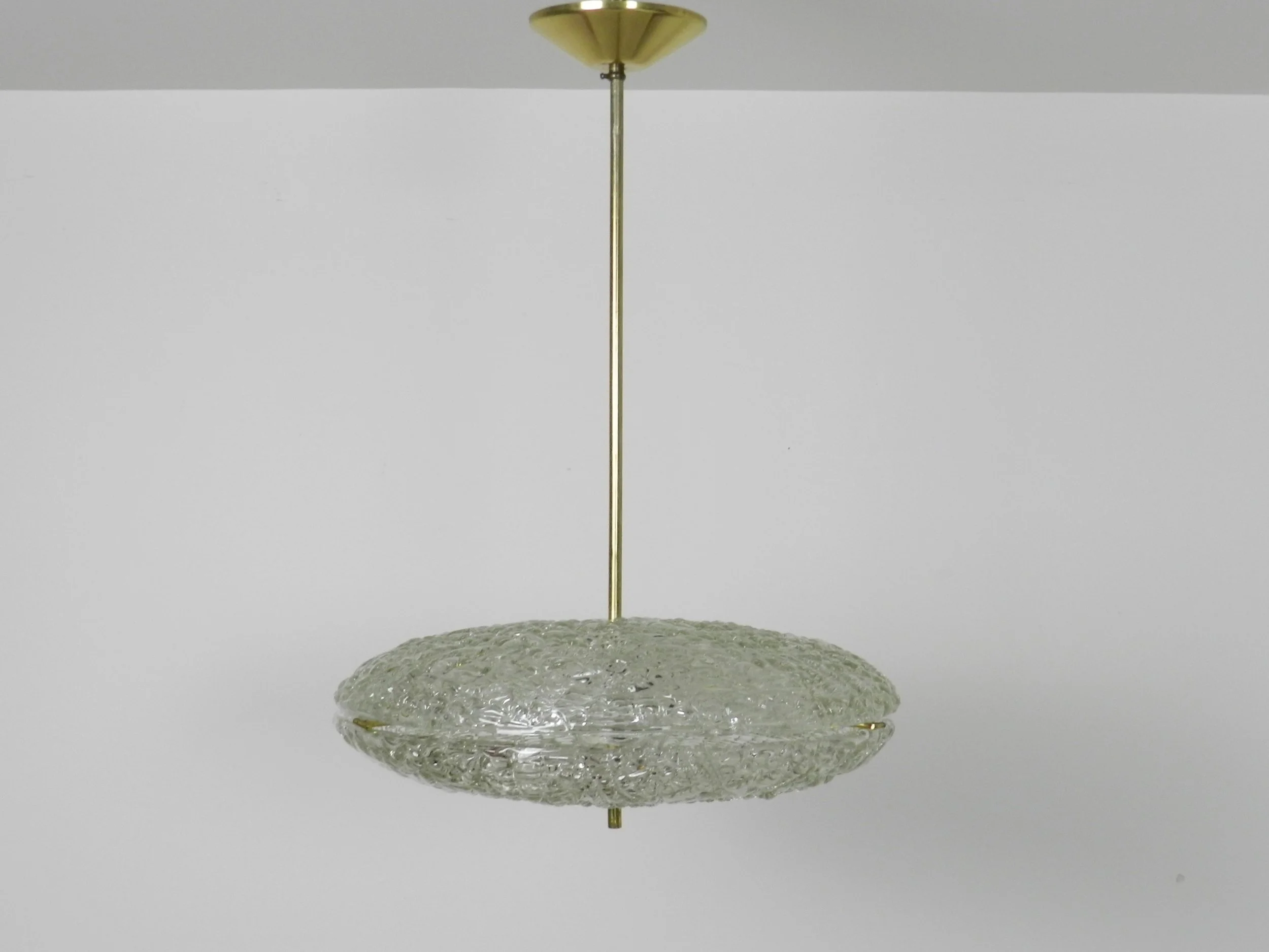 Crystal chandelier with brass hardware designed by Carl Fagerlund for Orrefors.  Sweden, 1950s.