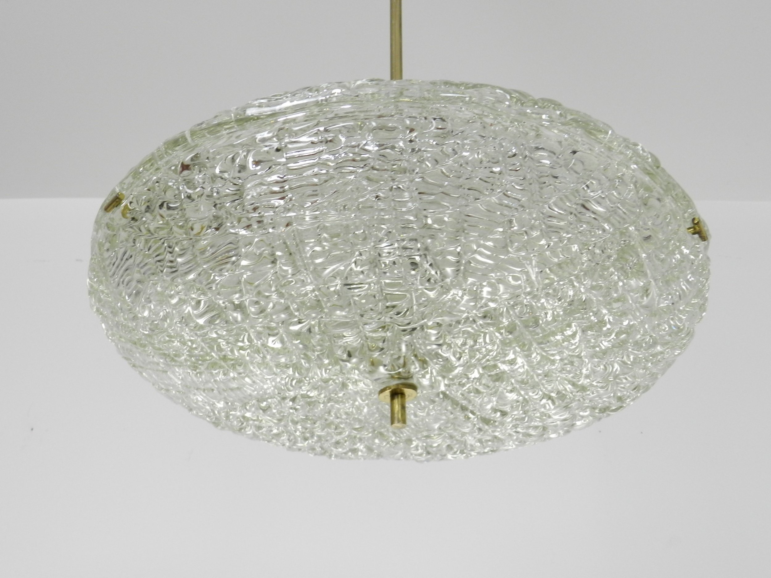 Crystal chandelier with brass hardware designed by Carl Fagerlund for Orrefors.  Sweden, 1950s.