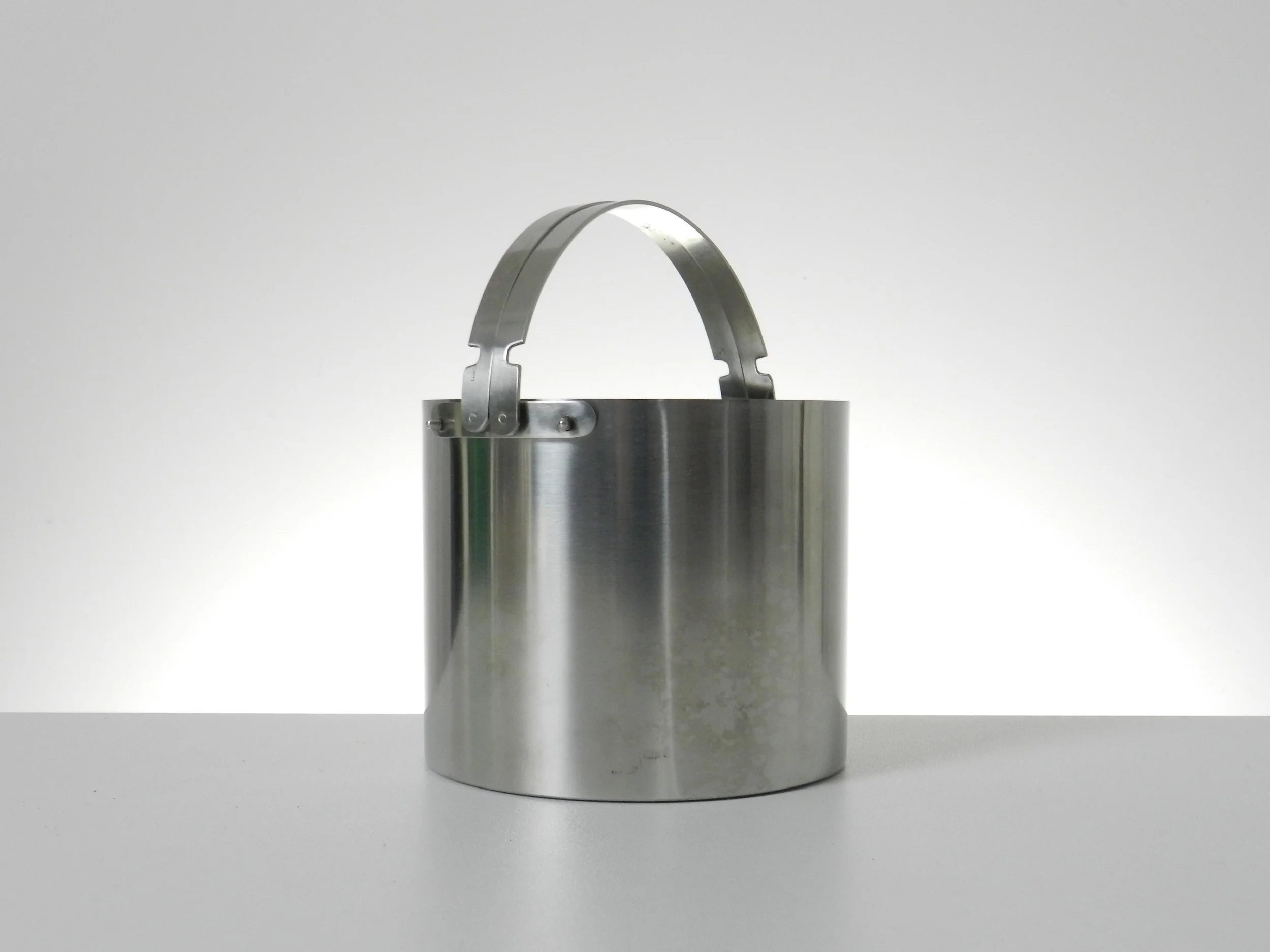 Stainless steel ice bucket designed by Arne Jacobsen for Stelton.  Denmark, 1960s.