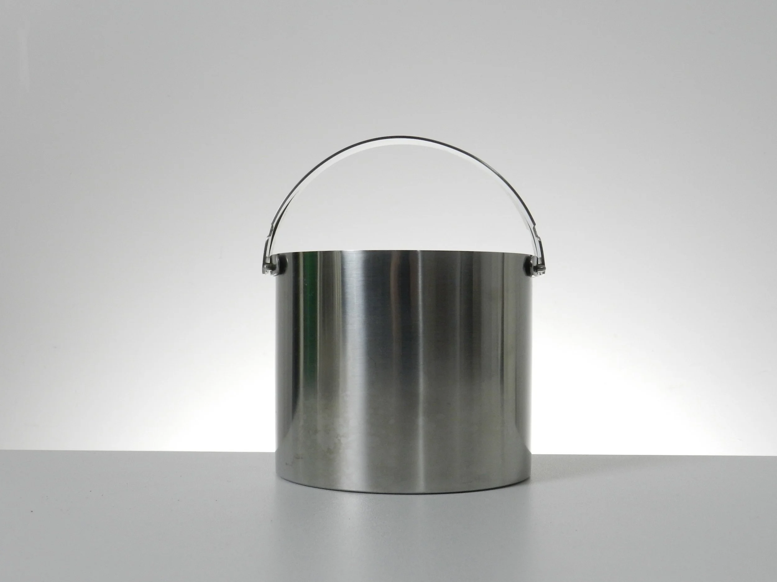 Stainless steel ice bucket designed by Arne Jacobsen for Stelton.  Denmark, 1960s.