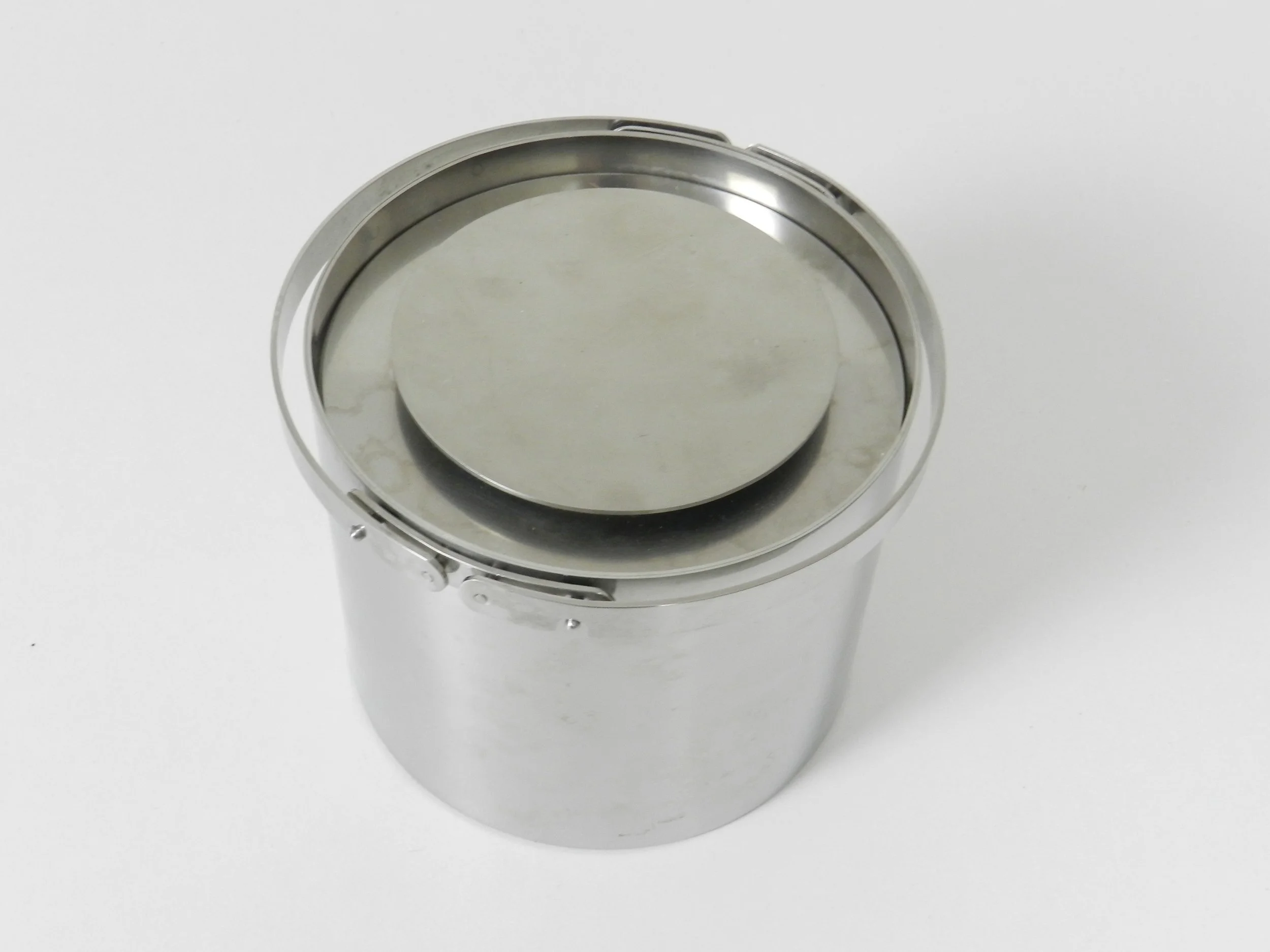 Stainless steel ice bucket designed by Arne Jacobsen for Stelton.  Denmark, 1960s.