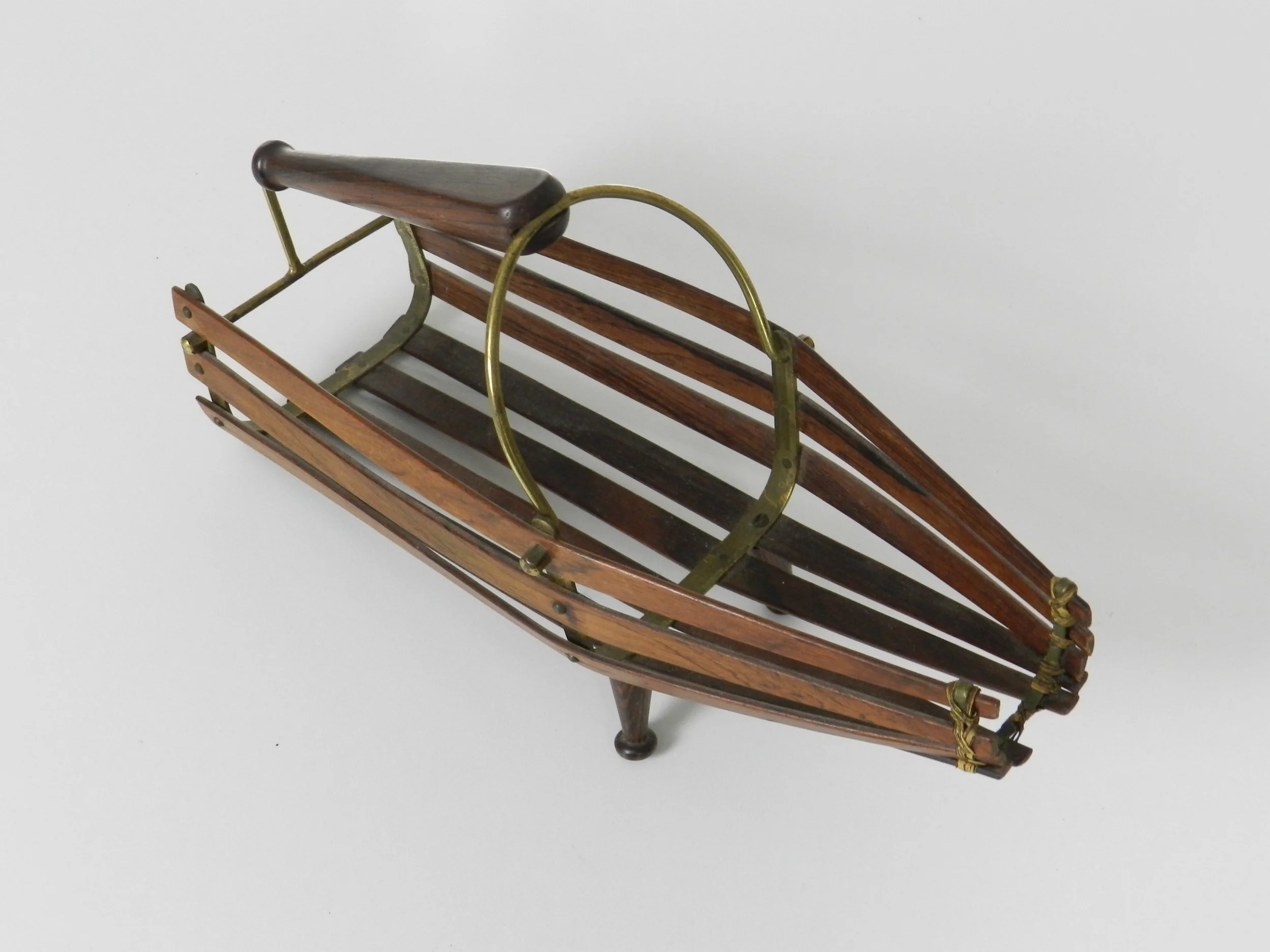 Wine bottle holder and pourer in rosewood with brass frame. Scandinavia