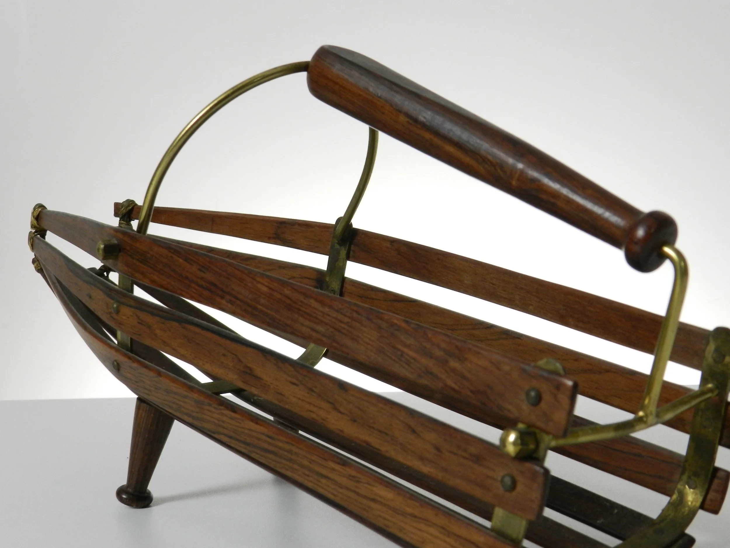 Wine bottle holder and pourer in rosewood with brass frame. Scandinavia