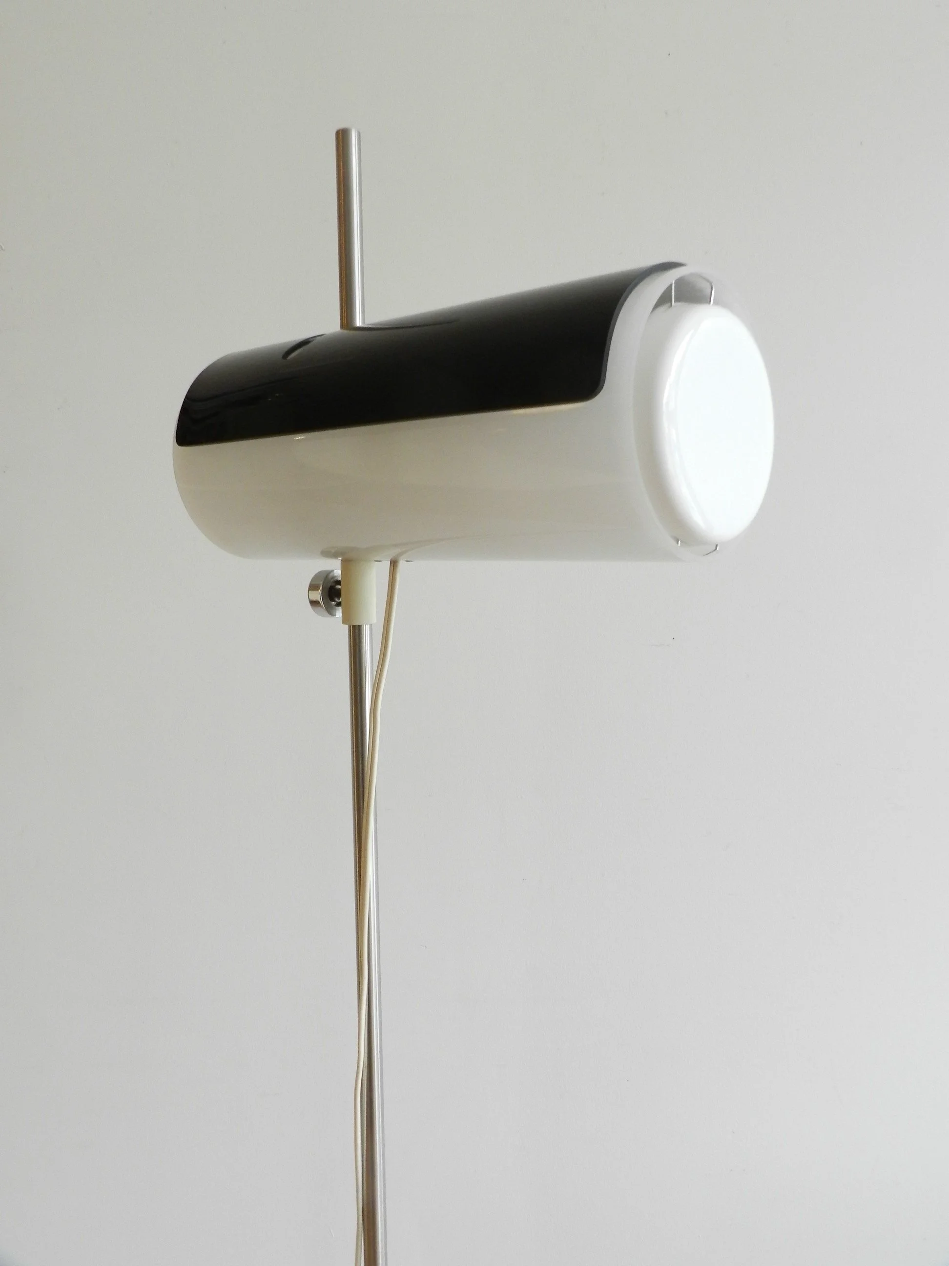Rare floor lamp attributed to Douglas Ball and John Berezowsky. Steel base and acrylic shade with adjustable viser.  Canada, 1960s.