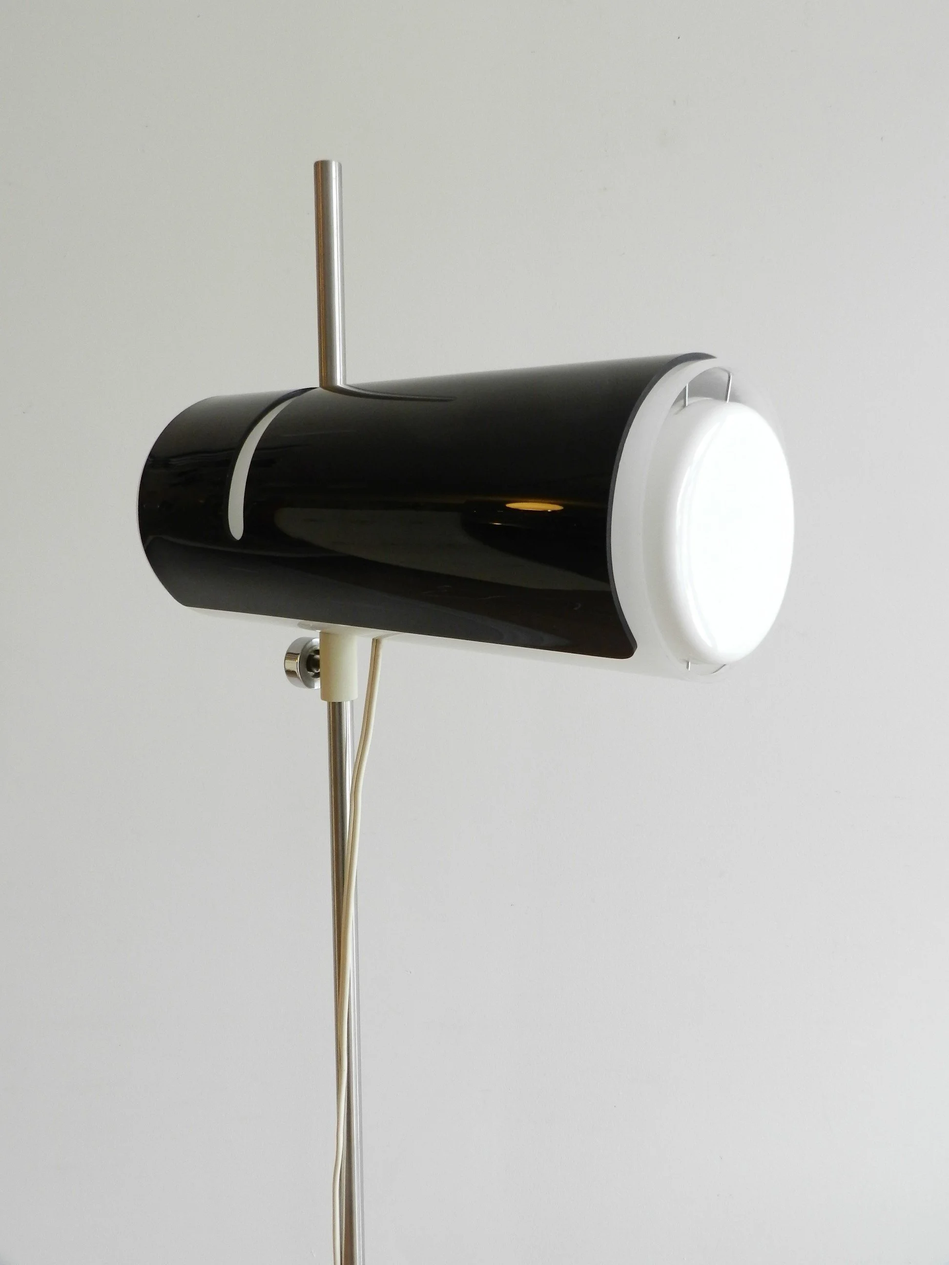 Rare floor lamp attributed to Douglas Ball and John Berezowsky. Steel base and acrylic shade with adjustable viser.  Canada, 1960s.
