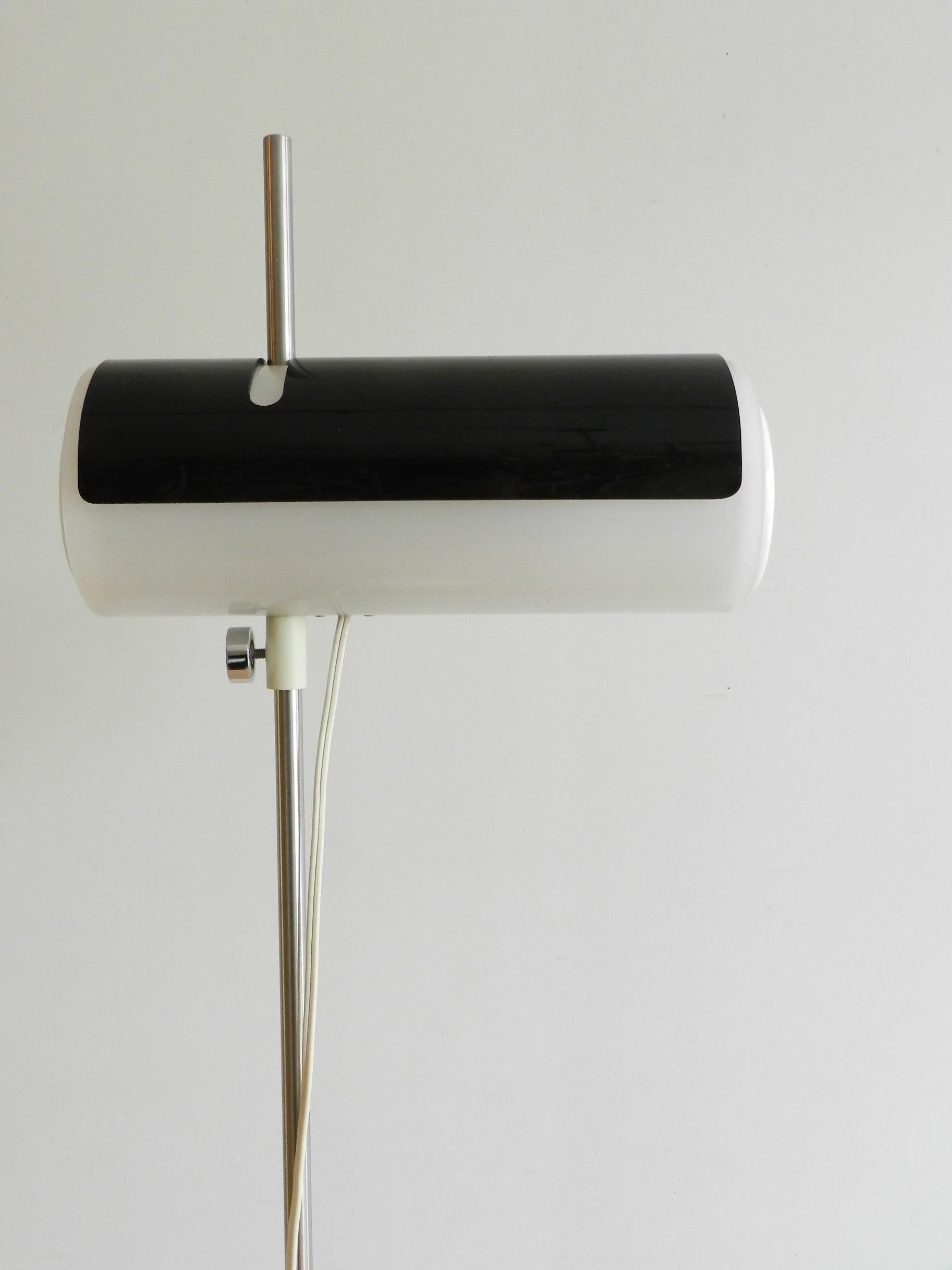 Rare floor lamp attributed to Douglas Ball and John Berezowsky. Steel base and acrylic shade with adjustable viser.  Canada, 1960s.