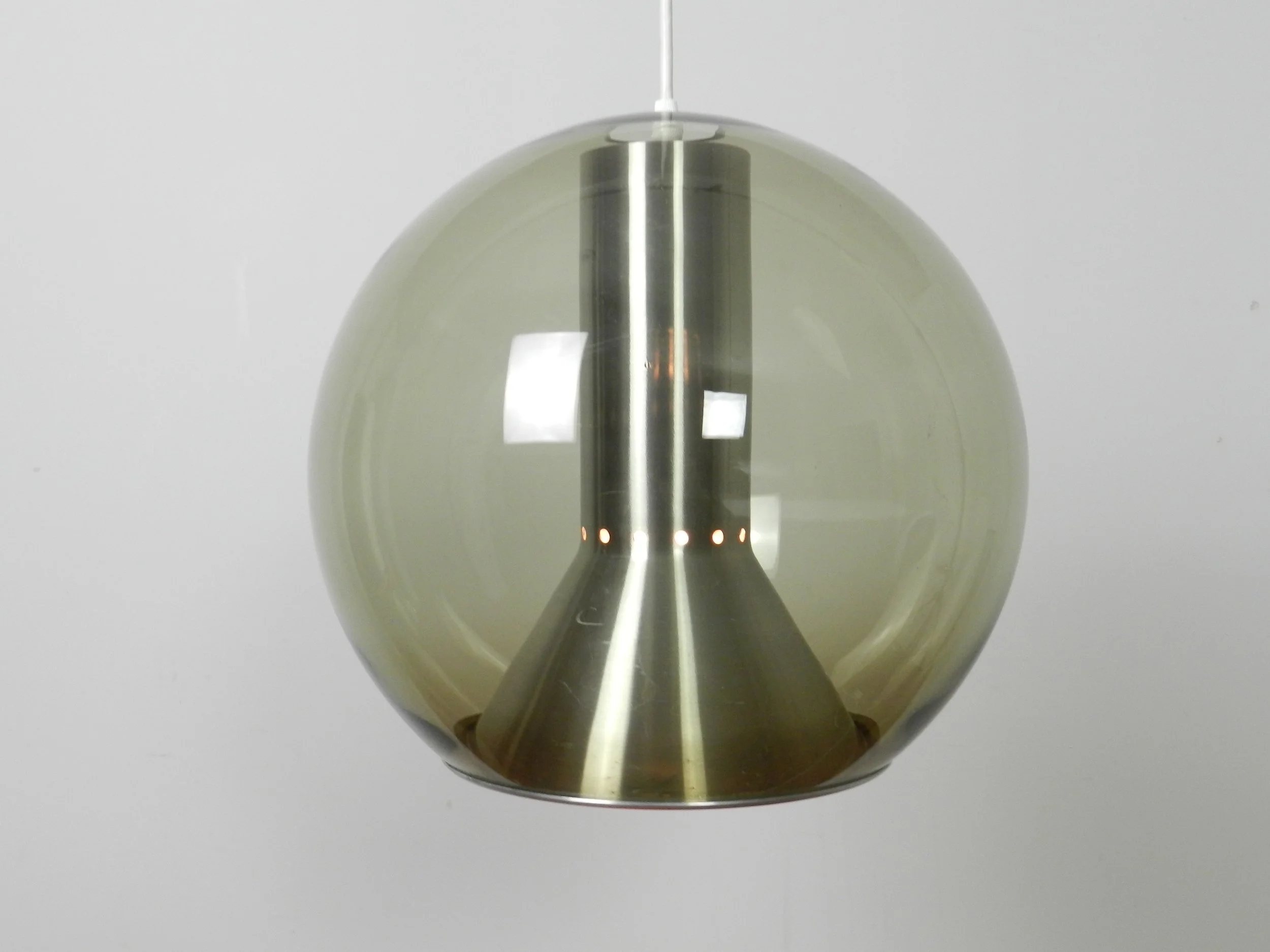 Large globe pendant lamp in glass and aluminum. Designed by Frank Ligtelijn for Raak.  Netherlands, 1960s.