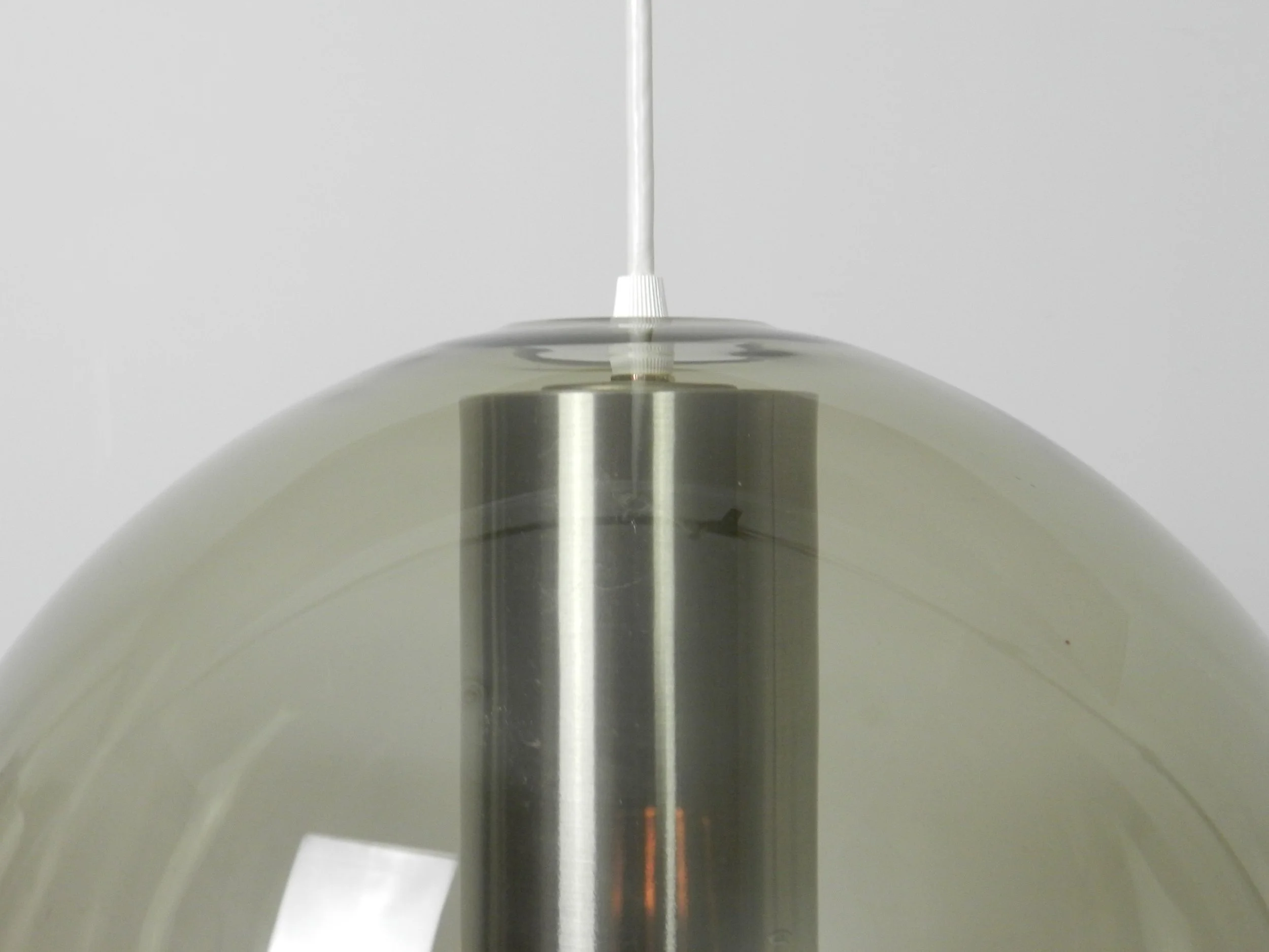 Large globe pendant lamp in glass and aluminum. Designed by Frank Ligtelijn for Raak.  Netherlands, 1960s.