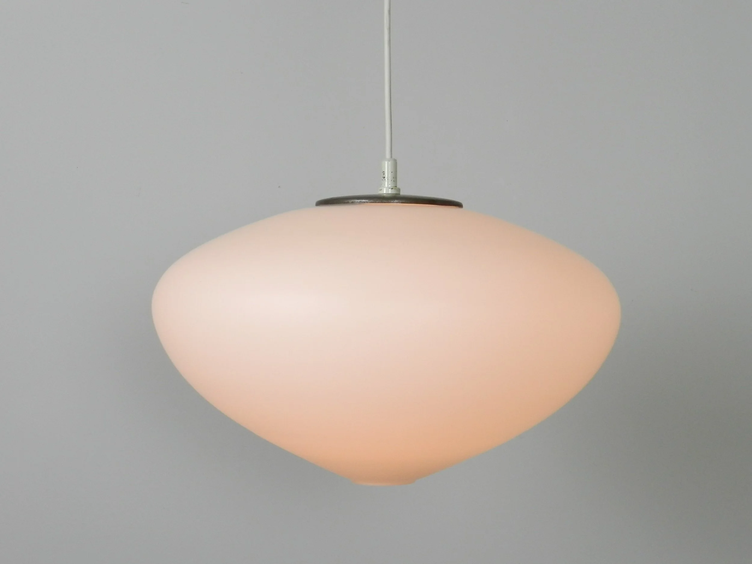 Large opaline glass pendant lamp by Raak.  Netherlands, 1960s.