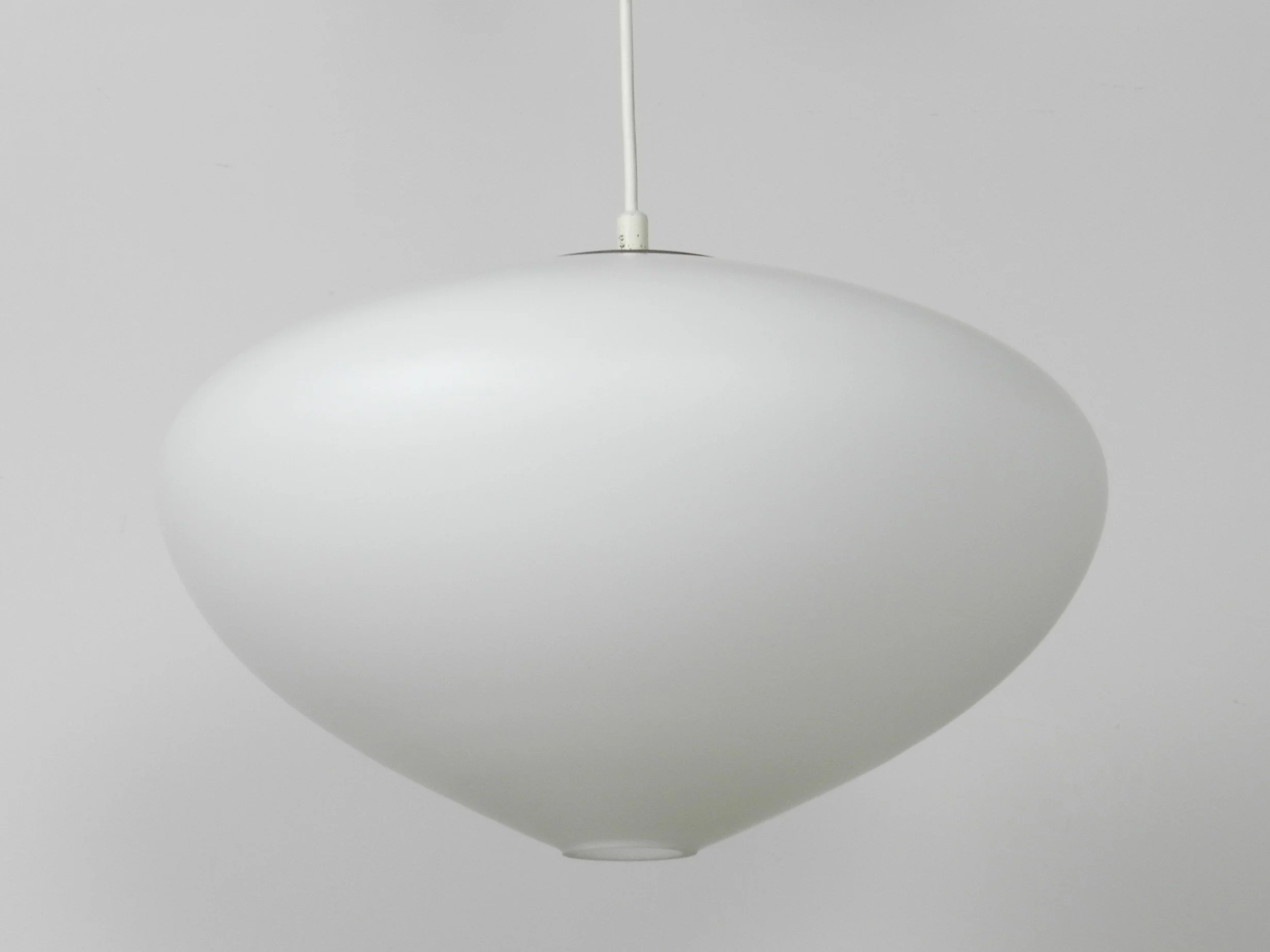 Large opaline glass pendant lamp by Raak.  Netherlands, 1960s.