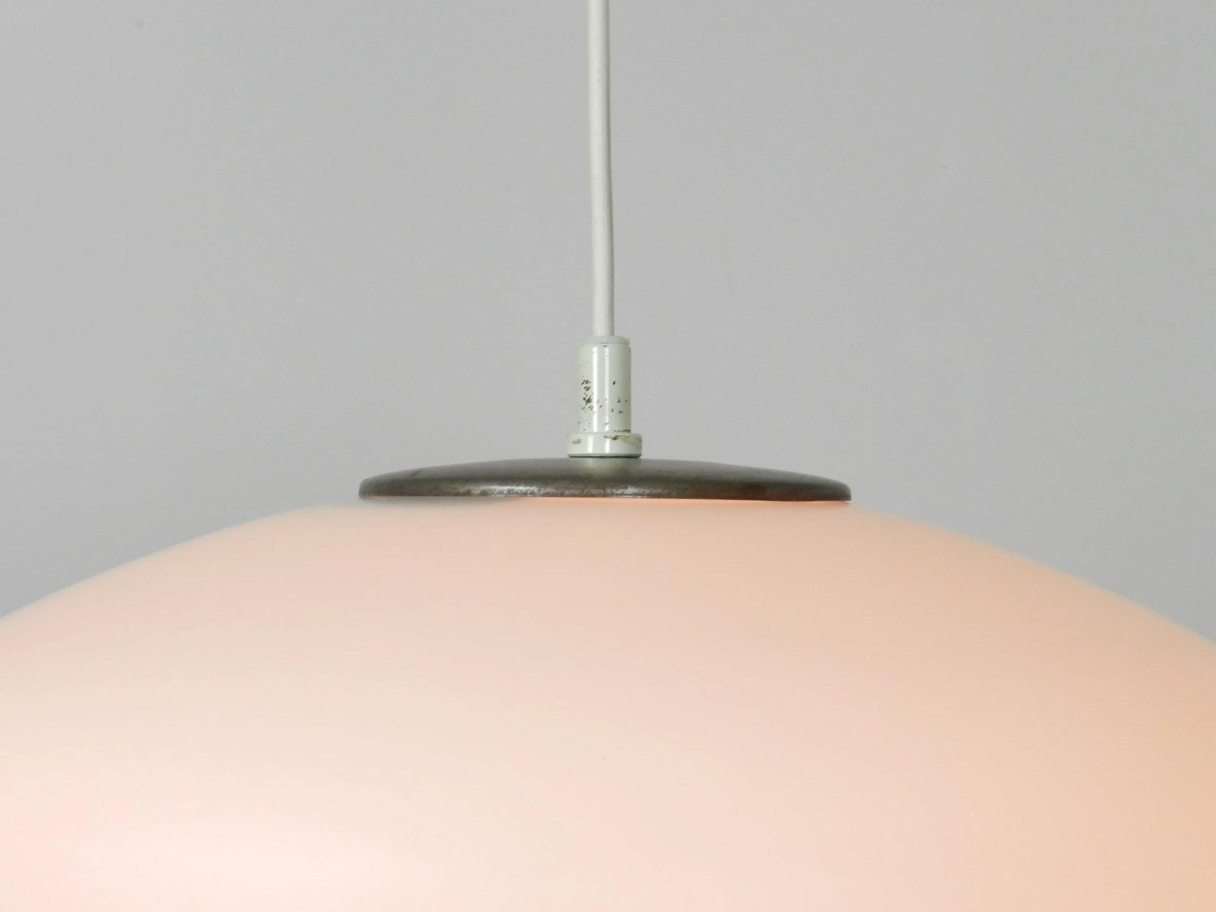 Large opaline glass pendant lamp by Raak.  Netherlands, 1960s.