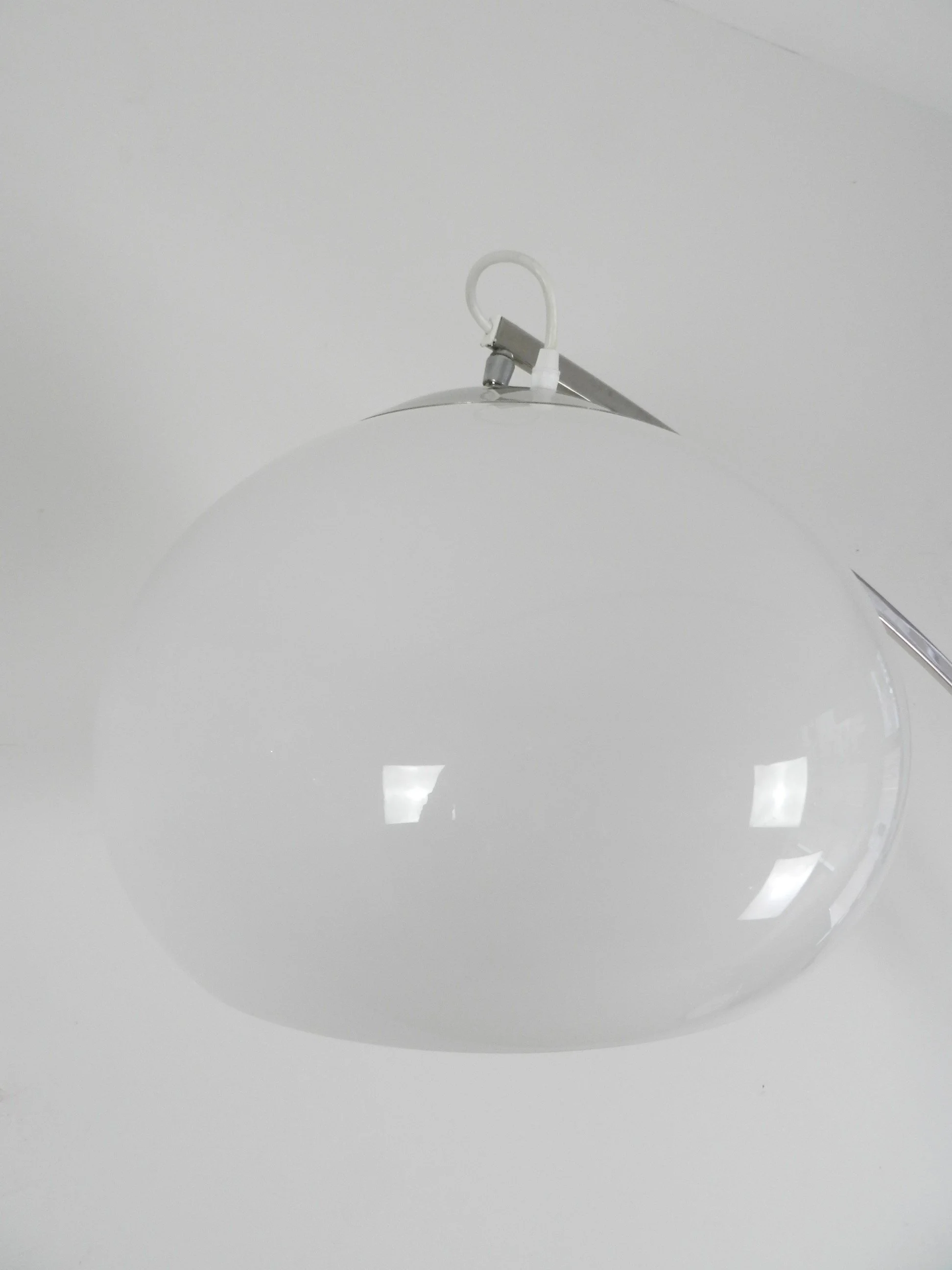 Adjustable arc lamp in chrome with acrylic shade by Reggiani.  Italy, 1970s.