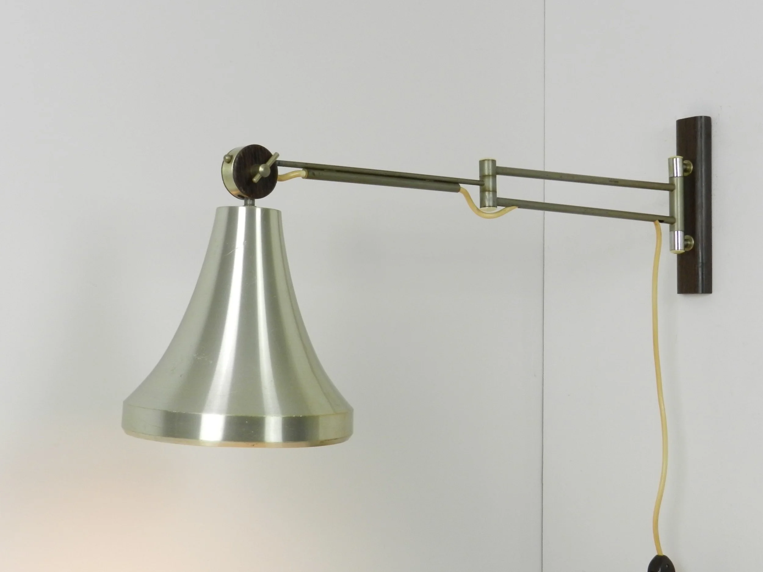 Mid century modern articulating wall lamp by Philips.  Netherlands, 1960s.