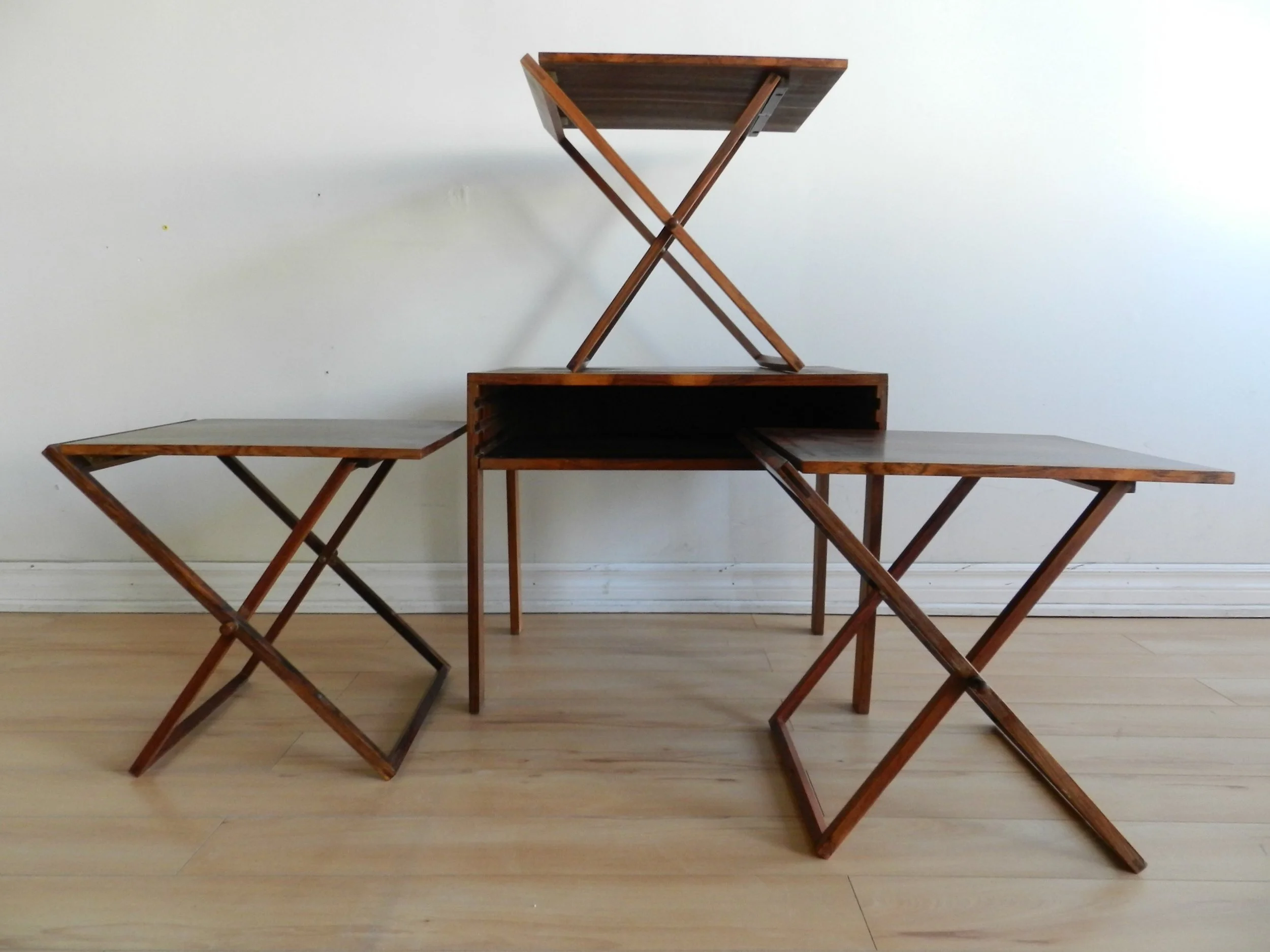 Set of rosewood folding tables designed by Illum Wikkelso for Silkeborg.  Denmark, 1960s.