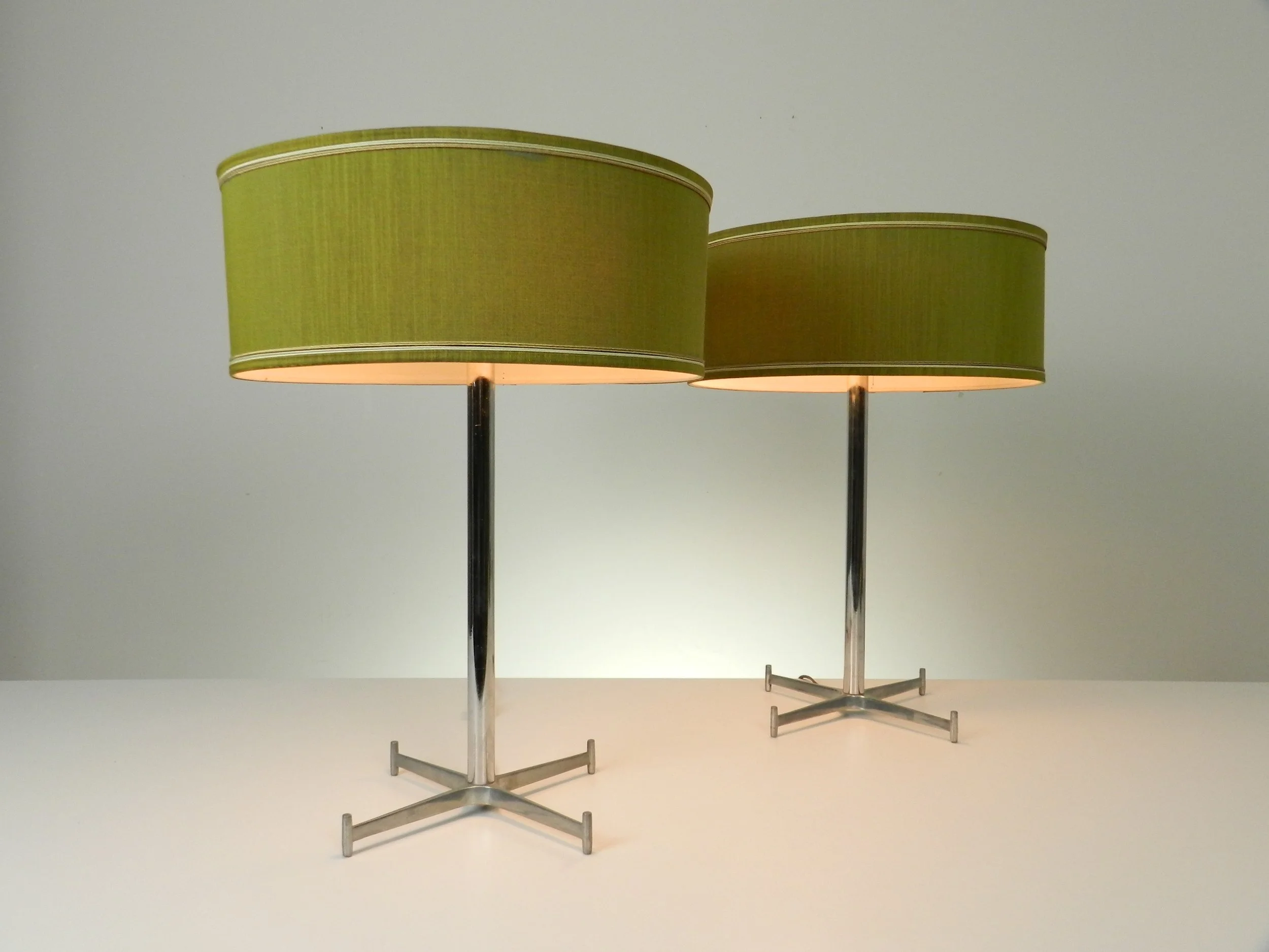 Pair of mid century chrome lamps with cast aluminum bases and original shades. Created by Electrohome.  Canada, 1960s.