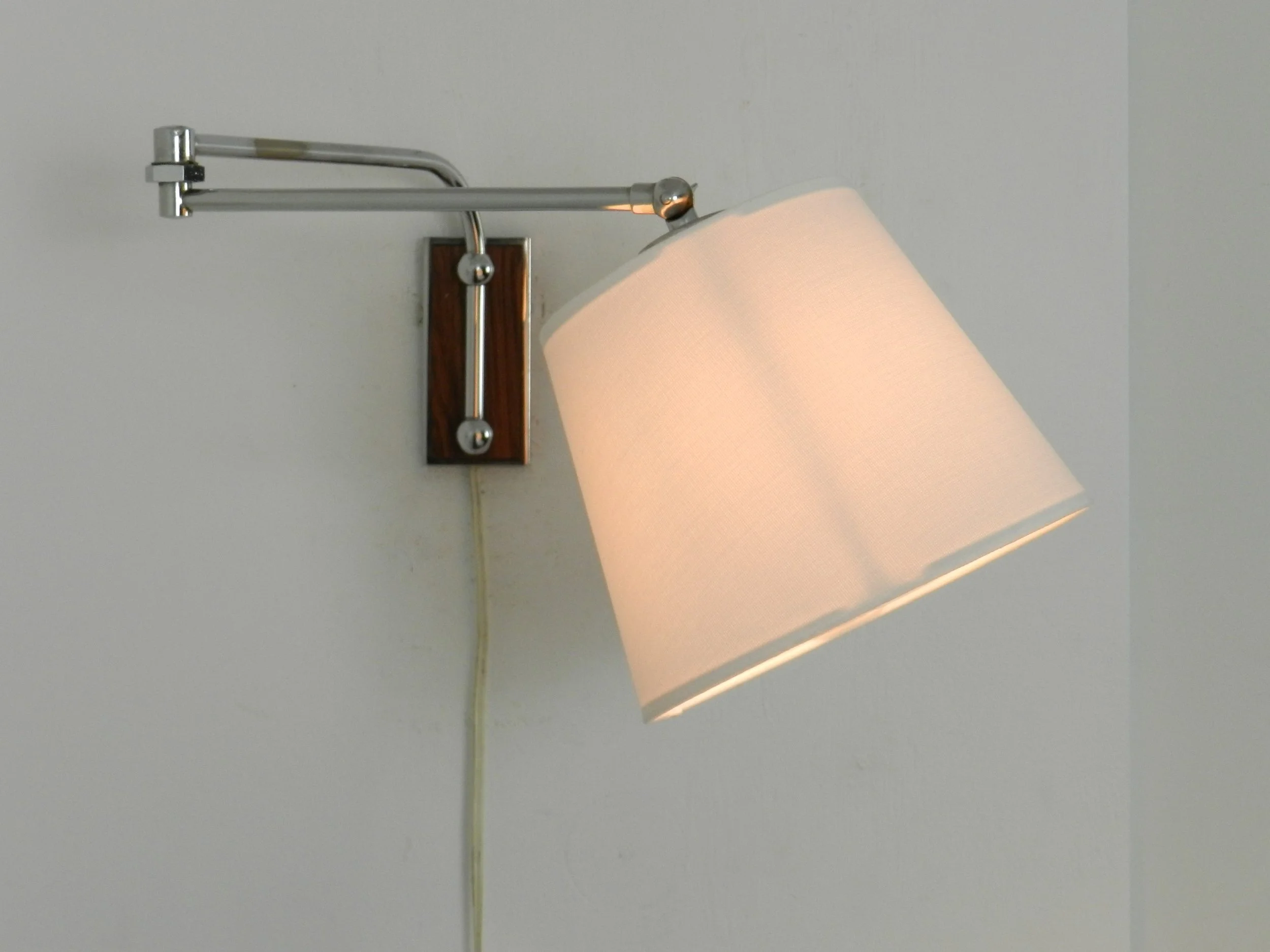 Mid century articulating wall lamp in chrome with new shade.  Netherlands, 1970s.